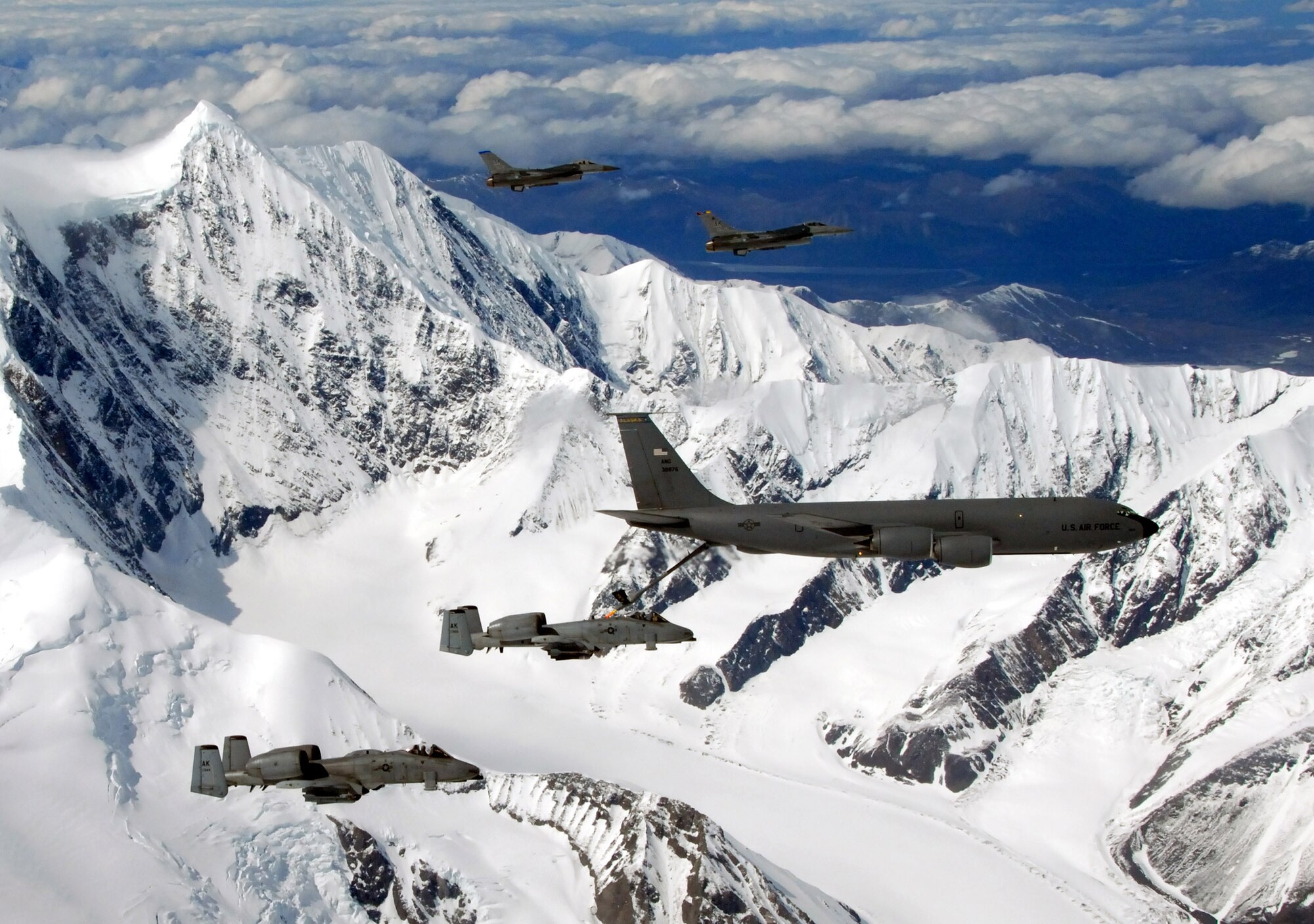 A KC-135 Stratotanker with the Alaska Air National Guard's 168th Air Refueling Wing  flies with two F-16 Fighting Falcons from the 18th Fighter Squadron and two A-10 Thunderbolt IIs from the 355th Fighter Squadron May 29 over Alaska. The five aircraft assigned to Eielson Air Force Base, Alaska, flew in formation for the last time due to the deactivation of the 18th and 355th Fighter Squadrons. (U.S. Air Force photo/Master Sgt. Rob Wieland)
