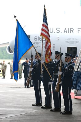 DOVER AIR FORCE BASE, Del. -- The Dover AFB Honor Guard stands at attention and presents the Colors during the C-17 Arrival Ceremony in Building 706 June 4 Team Dover recieved its first of 13 C-17 Globemaster III airlifters during the ceremony. (U.S. Air Force photo/Roland Balik)