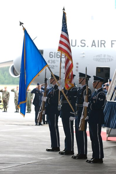 DOVER AIR FORCE BASE, Del. -- The Dover AFB Honor Guard stands at attention and presents the Colors during the C-17 Arrival Ceremony in Building 706 June 4 Team Dover recieved its first of 13 C-17 Globemaster III airlifters during the ceremony. (U.S. Air Force photo/Roland Balik)