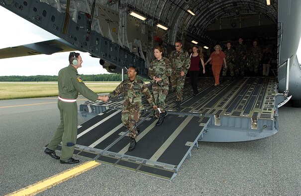 DOVER AIR FORCE BASE, Del. -- Lt. Col. Keith Thibodeaux, 3rd Airlift Squadron commander, welcomes Airmen back from an incentive flight aboard the 'Spirit of the Constitution,' Dover's first C-17 Globemaster III June 5. The incentive flight included an in-air refueling and introduced more than 40 Team Dover active duty, Reserve and civilian members, to the airlift mission they support everyday.  (U.S. Air Force photo/Jason Minto)