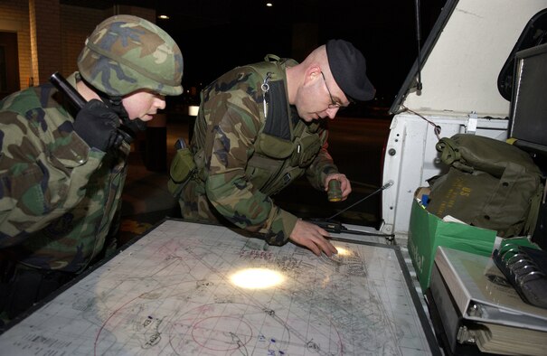 Security Forces members use a map of Malmstrom base housing to determine their next course of action during an exercise scenario in February 2006 – the last time the base was inspected. Inspectors will arrive at Malmstrom June 11 with the first of two inspections slated to begin June 12. Team Malmstrom will be evaluated on various aspects of the mission through June 25. (U.S. Air Force file photo)