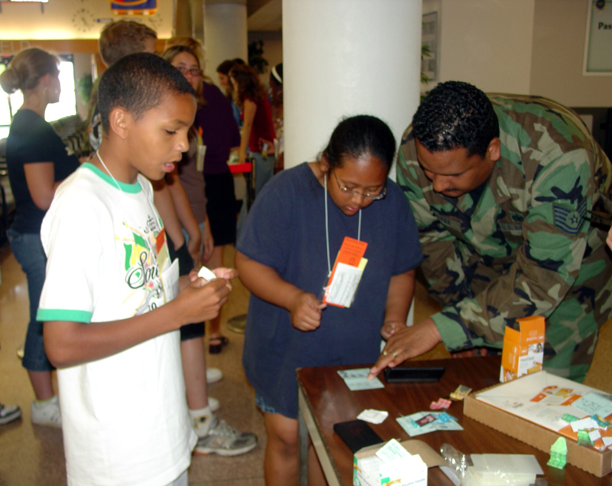 Sixth graders from the North Hanover School district get fingerprinted as they prepare to "deploy" to Camp Camel. The goal was to educate sixth grade children on the processes and procedures their parents encounter prior to, during and after a deployment. Additional goals were to increase the children's awareness of safety and security provided to their parents while deployed.