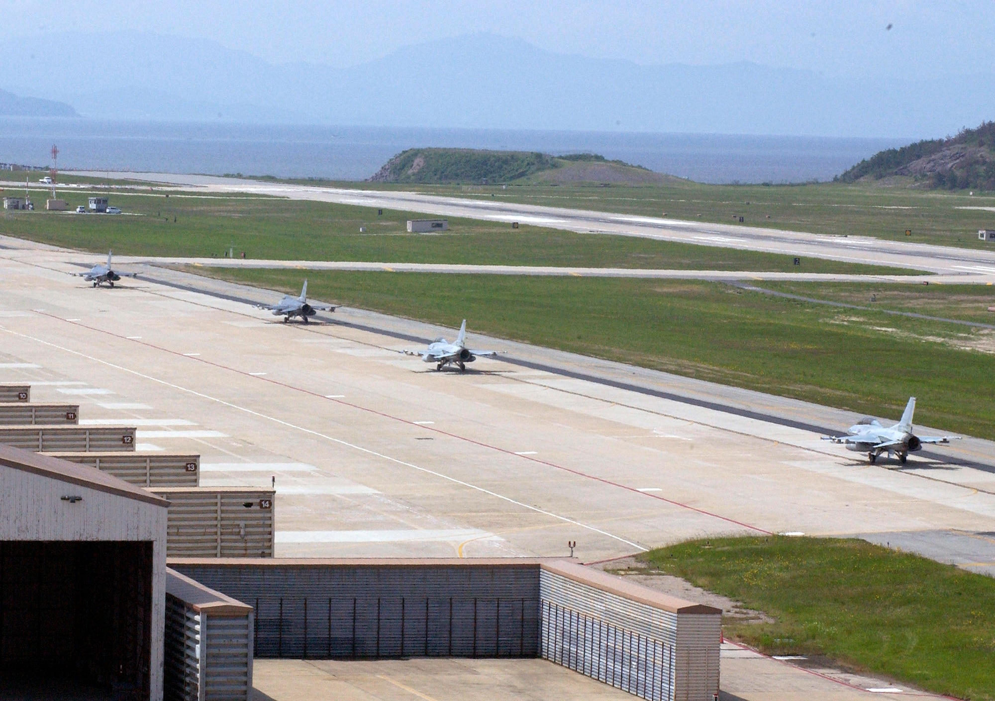 F-16 Fighting Falcons from the 8th Fighter Wing and South Korean air force's 111th Fighter wing prepare to take off for a joint training exercise June 8 from Kunsan Air Base. South Korea. This is the first time since the South Korean 111th Fighter Squadron moved to Kunsan AB that the South Korean and American units have briefed, flown and debriefed together on a dedicated mission. (U.S. Air Force photo/Staff Sgt. Darcie Ibidapo) 
