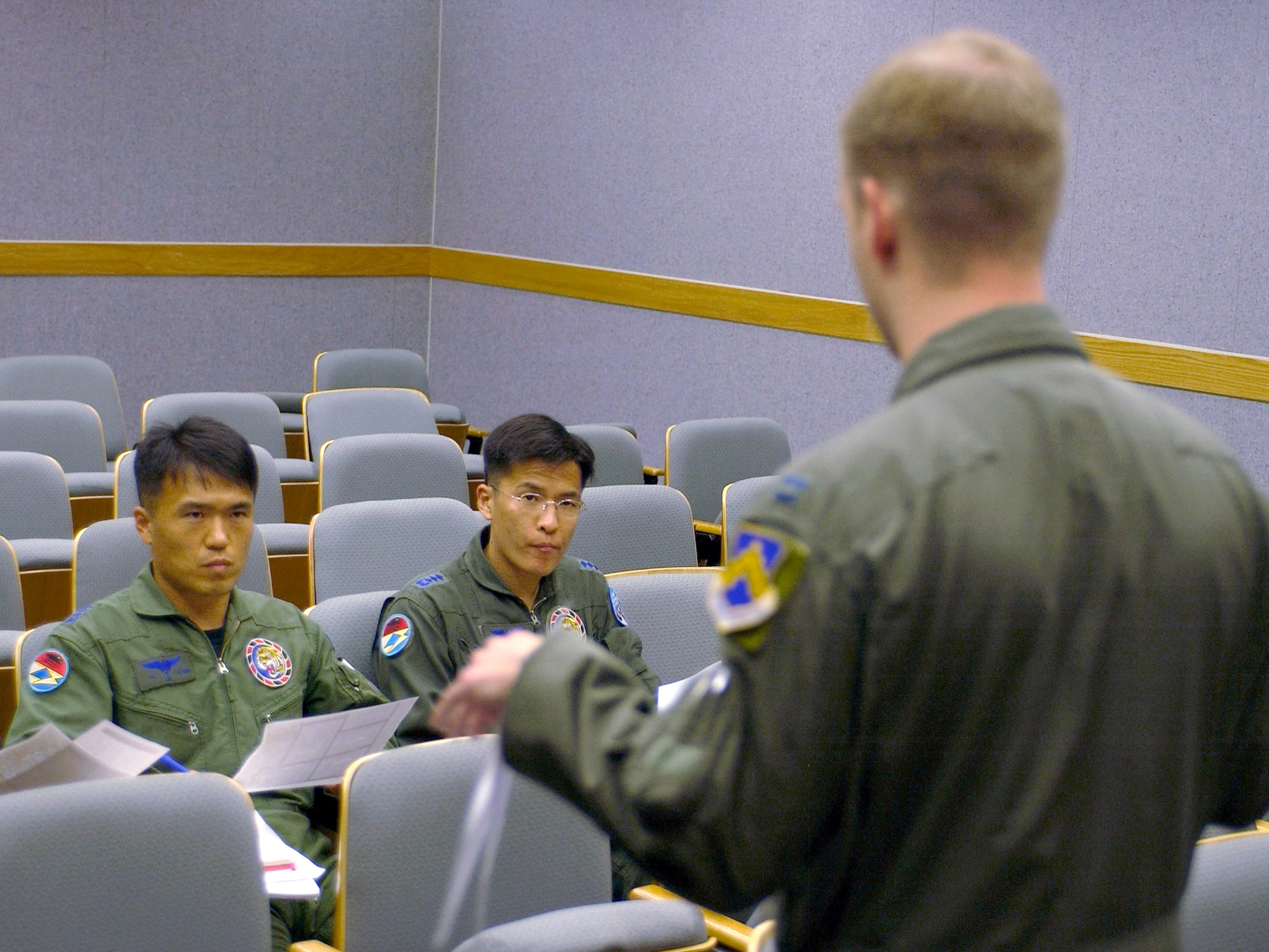 Capt. Luther Cross briefs South Korean air force pilots Capt. Jueng Geun Lee and Capt. Chang Soon Im June 8 for an exercise at Kunsan Air Base, South Korea. This is the first time since the South Korean 111th Fighter Squadron moved to Kunsan AB that the South Korean and American units have briefed, flown and debriefed together on a dedicated mission. Captain Cross is a 35th Fighter Wing pilot. (U.S. Air Force photo/Staff Sgt. Darcie Ibidapo) 