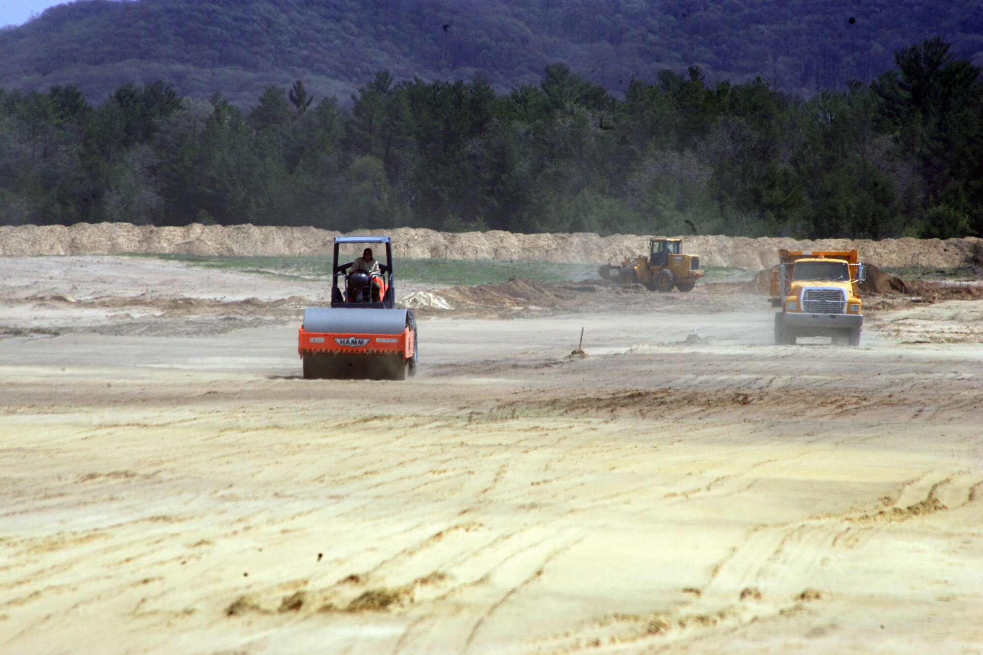 Air Force personnel from the 819th (Airborne) RED HORSE) Squadron work on the Young Air Assault Strip runway during a training stint at Fort McCoy April 16 through May 11.  (Photo by Rob Schuette, PAO, Fort McCoy, WI.) 