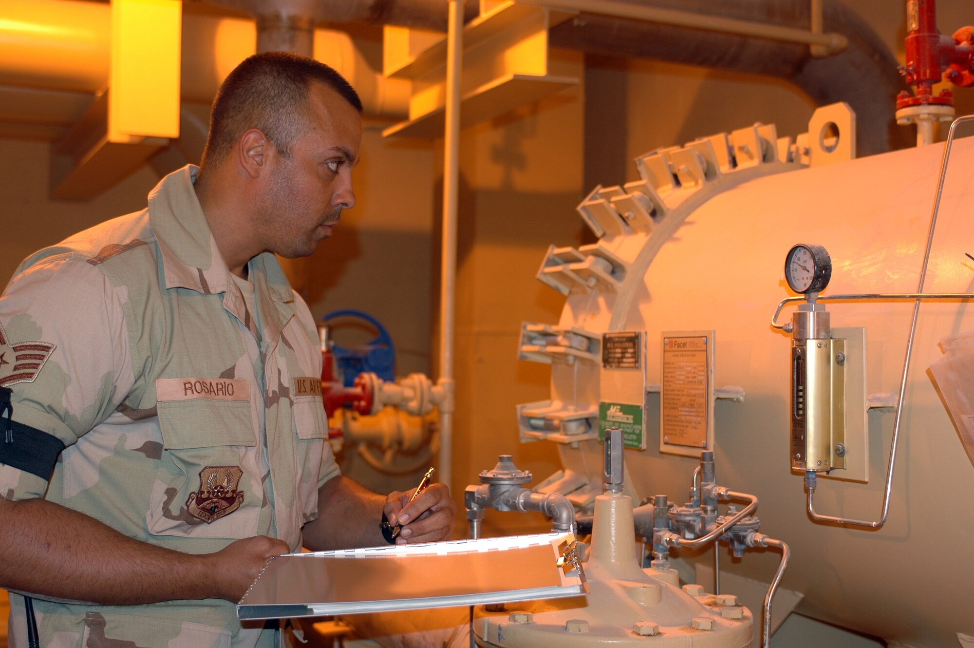 Staff Sgt. Marcos Rosario, 379th Expeditionary Logistics Readiness Squadron, records the differential pressure on a filter separator June 11.