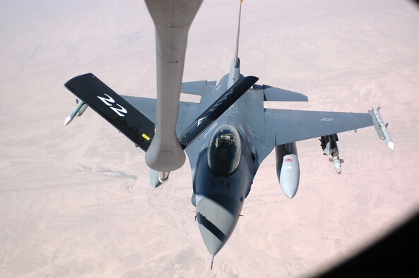 An F-16 from the 13th Expeditionary Fighter Squadron from Balad Air Base, Iraq, gets fuel from a KC-135 June 3. The aircraft was providing close air support for ground forces in Iraq. (Photo by Senior Airman Clark Staehle)