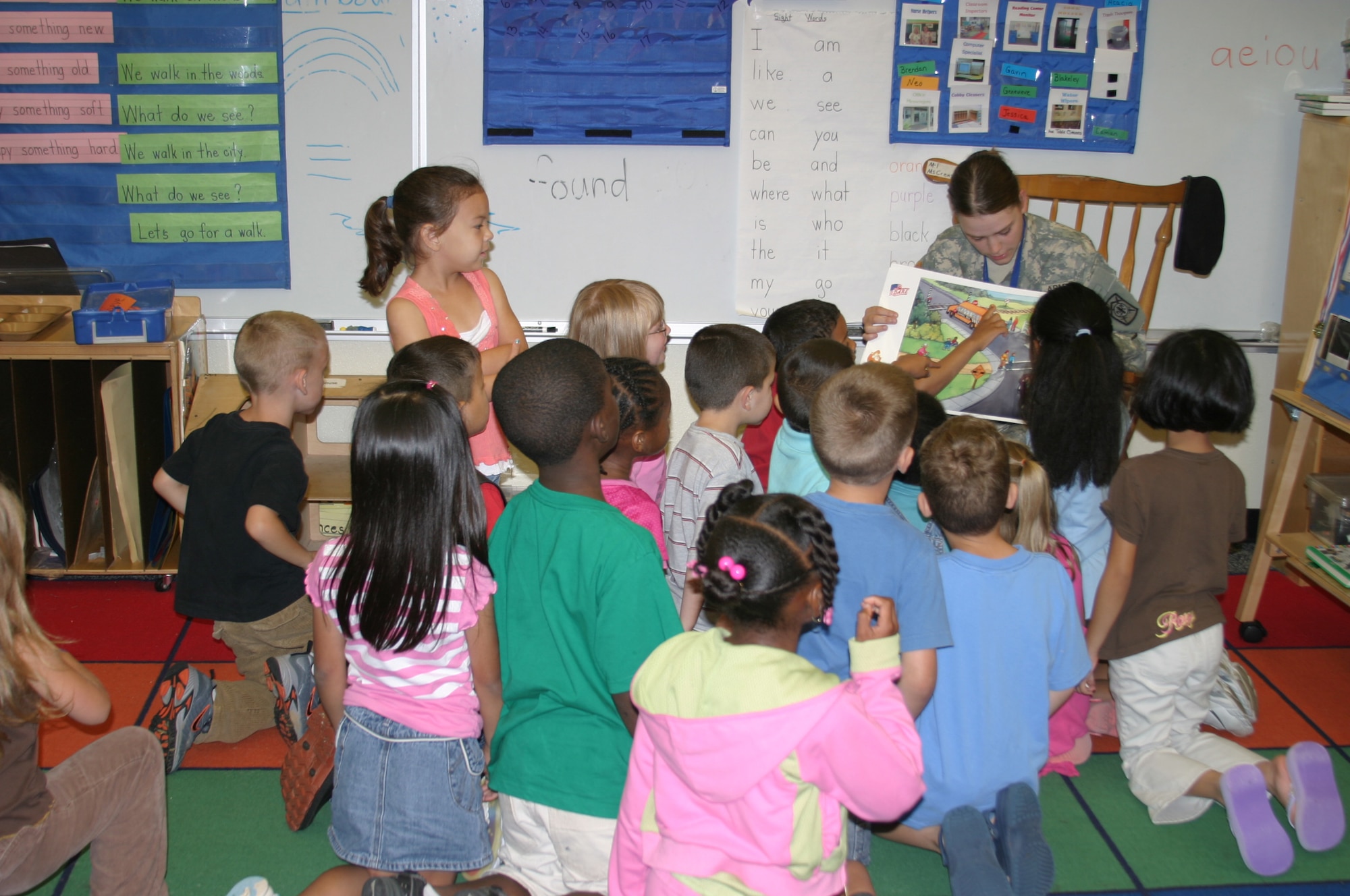 Army Pvt. Brandy Yocum, DARE officer, shows kindergarten students a visual aid during a class on general safety practices at Kadena Air Base, Japan. Military police members from the Army, Navy and Marines taught students at base schools May 17 the skills they need to avoid involvement in drugs, gangs, and violence. The classes were taught as part of the Drug Abuse Resistance Education program.
(U.S. Air Force/Senior Airman Nestor Cruz)