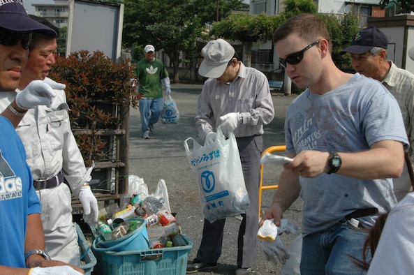 Volunteers from the 374th Logistics Readiness Squadron and the Mizuho community seperate trash collected during the 25th Mizuho Town Annual Cleanup. This year the Mizuho communty invited 374th LRS to help with the cleanup. Photo by Airman 1st Class Eric Summers VIRIN 070604-F-9864S-047)