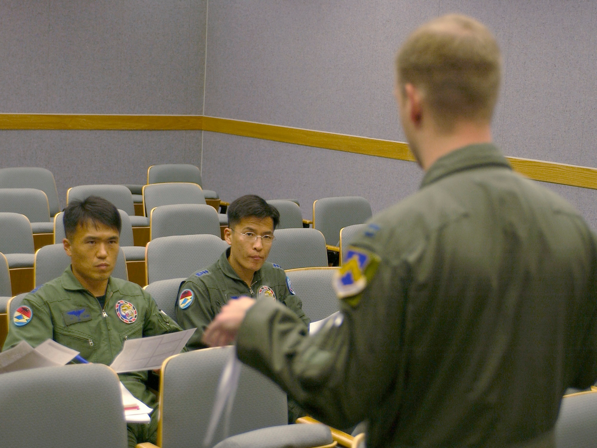 KUNSAN AIR BASE, Republic of Korea -- Capt. Luther Cross, 35th Fighter Wing pilot briefs Republic of Korea Air Force 111th FS pilots Capt Jueng Geun Lee (left) and Capt. Chang Soon Im June 8. This is the first time since the 111th FS moved here that the two units have briefed, flown and debriefed together on a dedicated mission. (U.S. Air Force photo by Staff Sgt. Darcie Ibidapo)