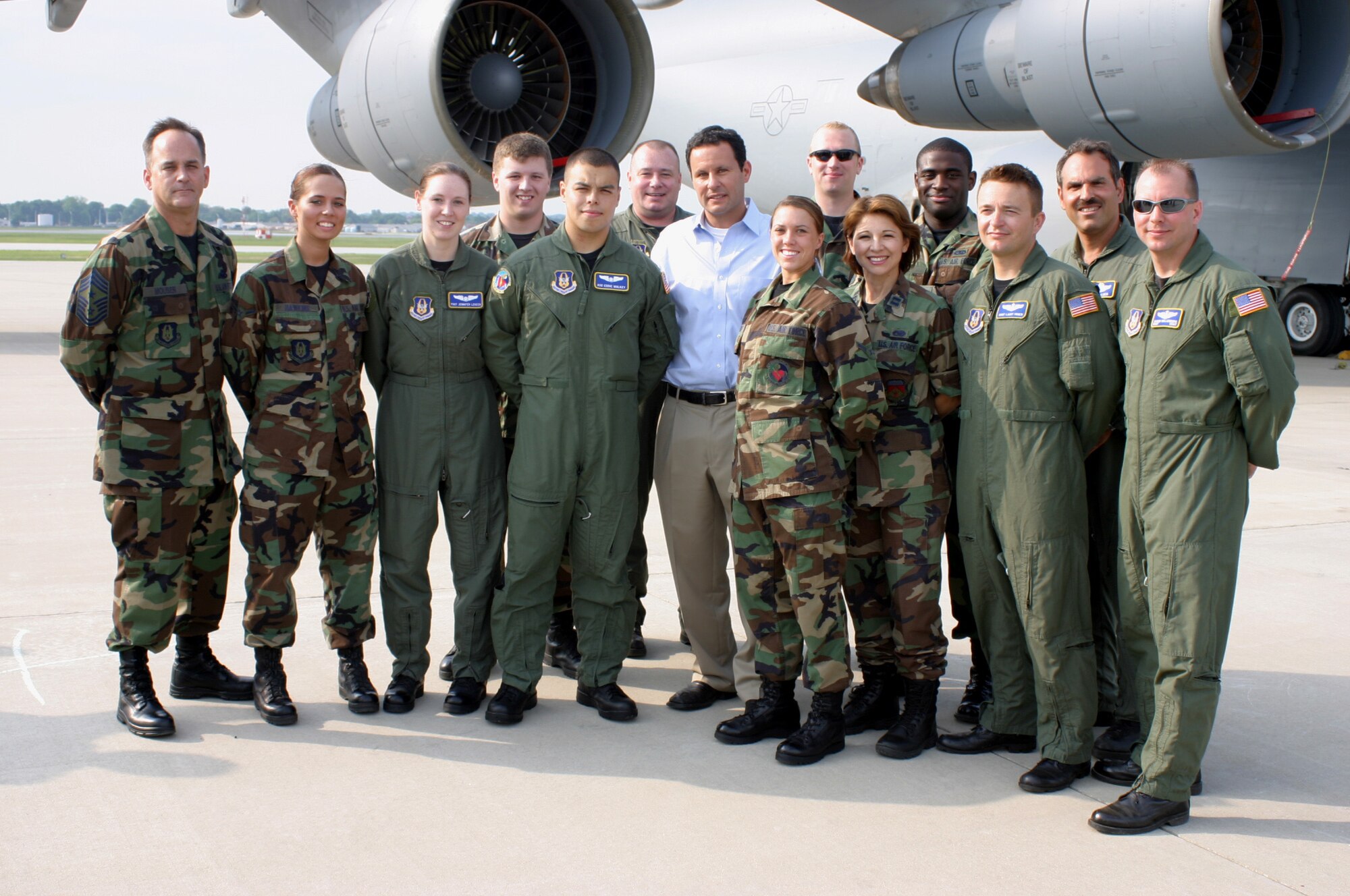 WRIGHT-PATTERSON AFB, Ohio – Air Force reservists from the 445th Airlift Wing has their photo taken with Brian Kilmeade (center) just after the live broadcast of "FOX and Friends" on June 8.  The show was broadcast from the base’s west ramp which is home to the wing’s C-5 Galaxy aircraft. (U.S. Air Force photo by Master Sgt. Doug Moore)