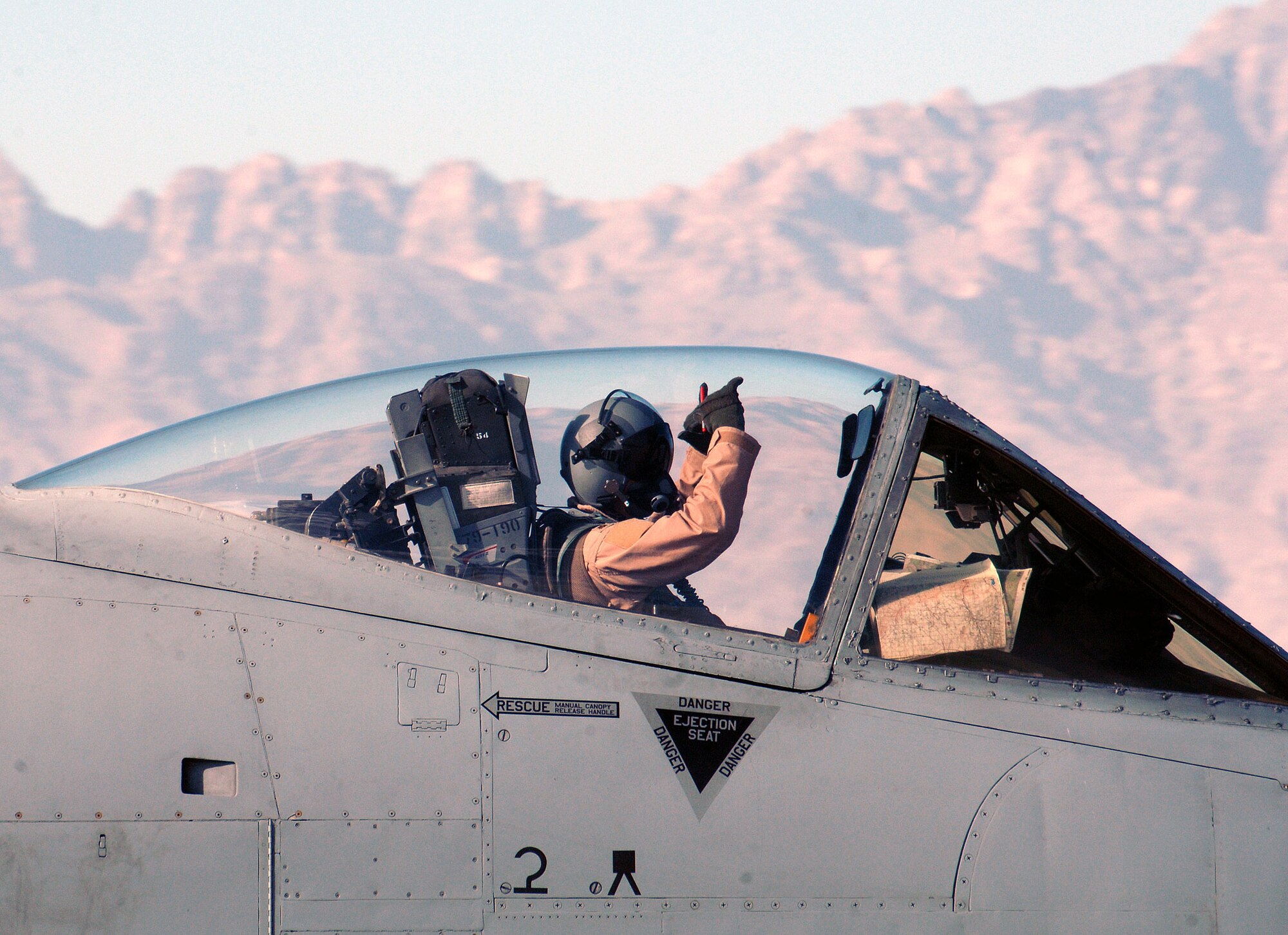 An A-10 pilot assigned to the 354th Expeditionary Fighter Squadron signals that he is "good to go" prior to a flight at Bagram Airfield, Afghanistan June 9. The 354th EFS is deployed from Davis-Monthan Air Force Base, Ariz. (photo by Staff Sgt. Craig Seals)