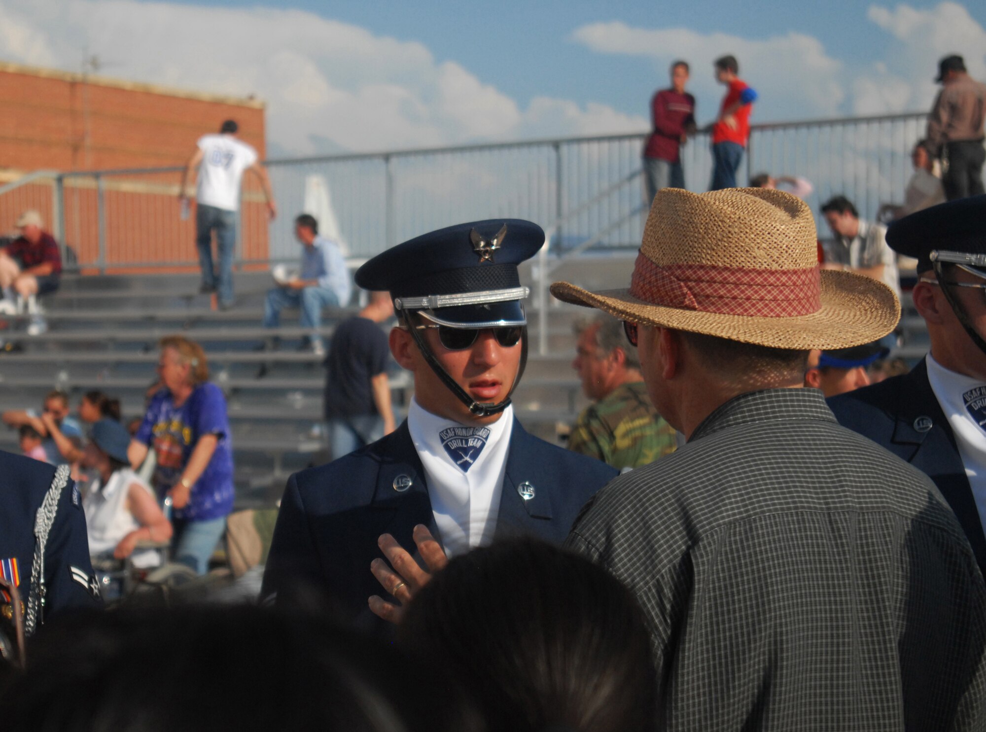 TINKER AFB, Okla. - Air Force Honor Guard Drill Team member, SrA Robert Bonello, speaks with an audience member following the Drill Team performance. The Drill Team is the traveling component of the Air Force Honor Guard and tours Air Force bases world wide showcasing the precision of today's Air Force to recruit, retain, and inspire Airmen for the Air Force mission. (U.S. Air Force Honor Guard photo by Senior Airman Nestor Bauer)(Released)