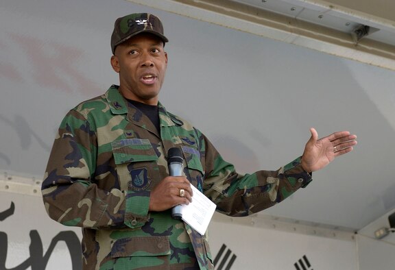 KUNSAN AIR BASE, Republic of Korea -- Col. CQ "Wolf" Brown, 8th Fighter Wing commander, addresses Airmen during a Wolf Call June 8 here. Colonel Brown discussed his four personal tenants of leadership -- to execute at a high standard, be disciplined in execution, pay attention to detail and to have fun. This is Colonel Brown's first Wolf Call since becoming the wing commander last month. (U.S. Air Force photo by Staff Sgt. Darcie Ibidapo)