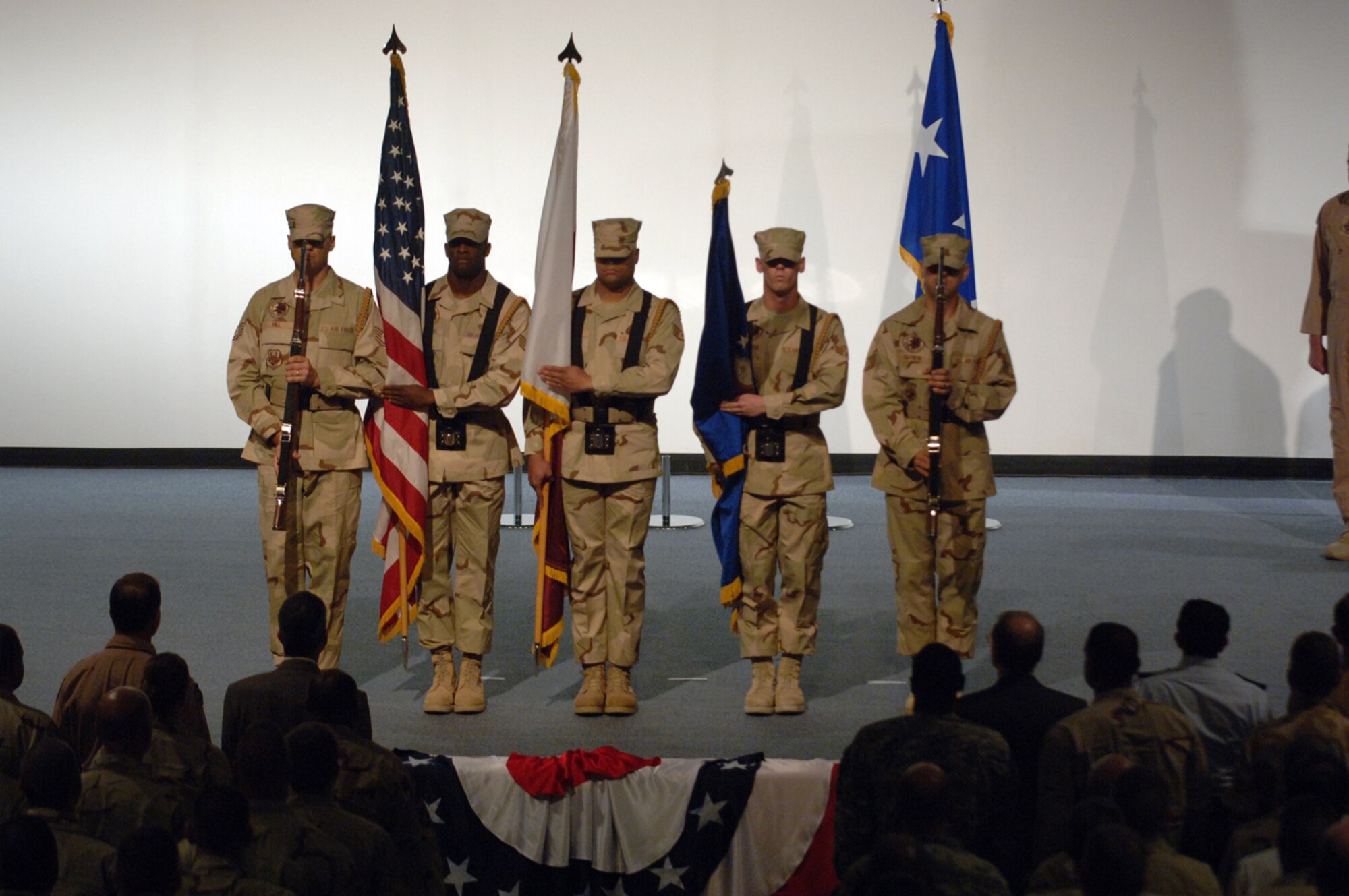 (From left) Tech. Sgt. Brian Hill, Staff Sgt. Denvice Jackson, Staff Sgt. Angel Gonzales, Senior Airman Brock Cochran, and Tech. Sgt. Sascha Harmon, all with the 379th Air Expeditionary Wing Honor Guard, post the colors during the 379th AEW change of command Tuesday. (U.S. Air Force photo by Master Sgt. Ken Stephens)