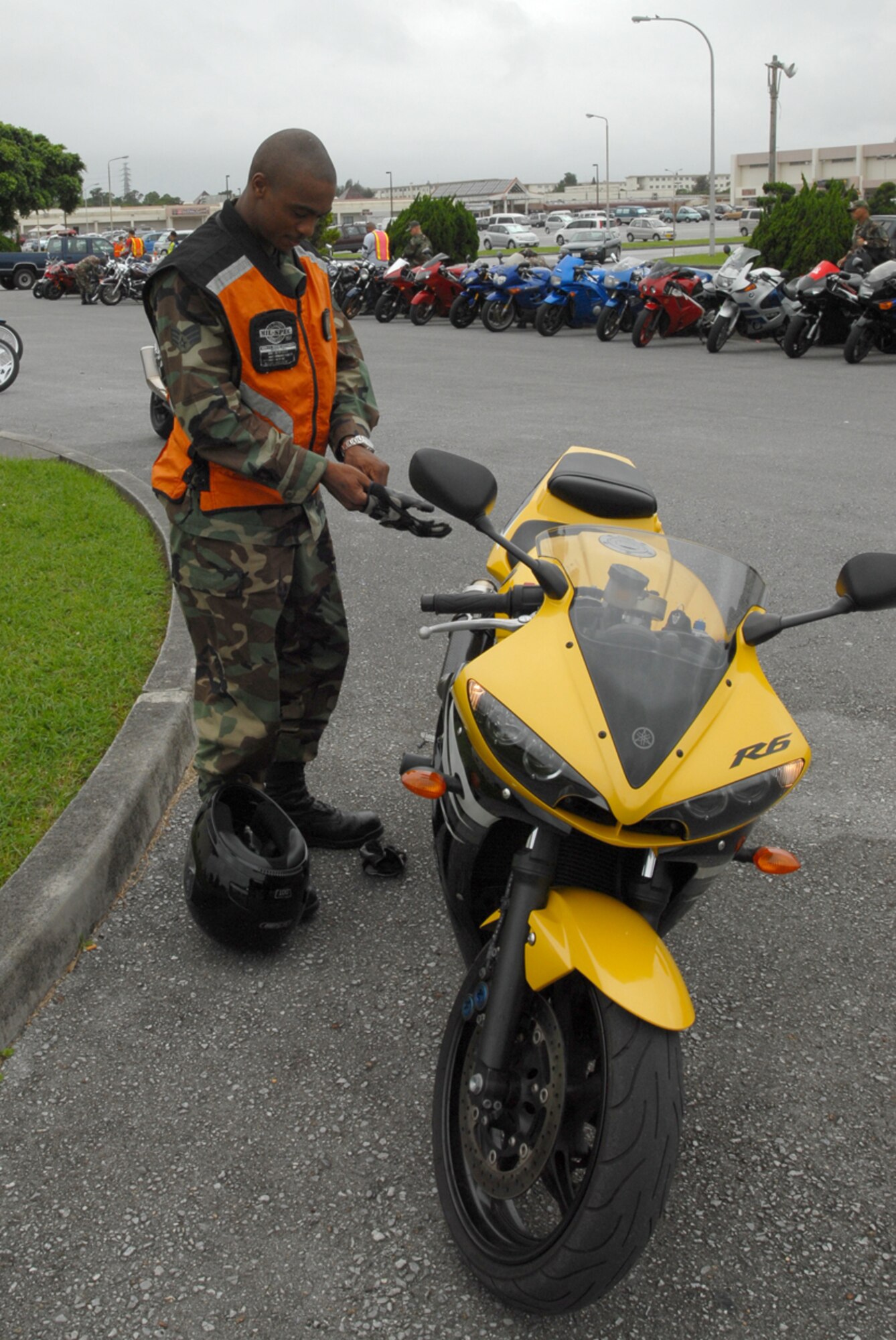 Senior Airman Jay Morgan, 18th Munitions Squadron, prepares to ride in the first annual Motorcycle Group Ride at Kadena Air Base, Japan, June 5. About 75 people participated in the ride which followed a motorcycle all-call where all base riders were given the latest mishap prevention information.
(U.S. Air Force/Airman 1st Class Kasey Zickmund)