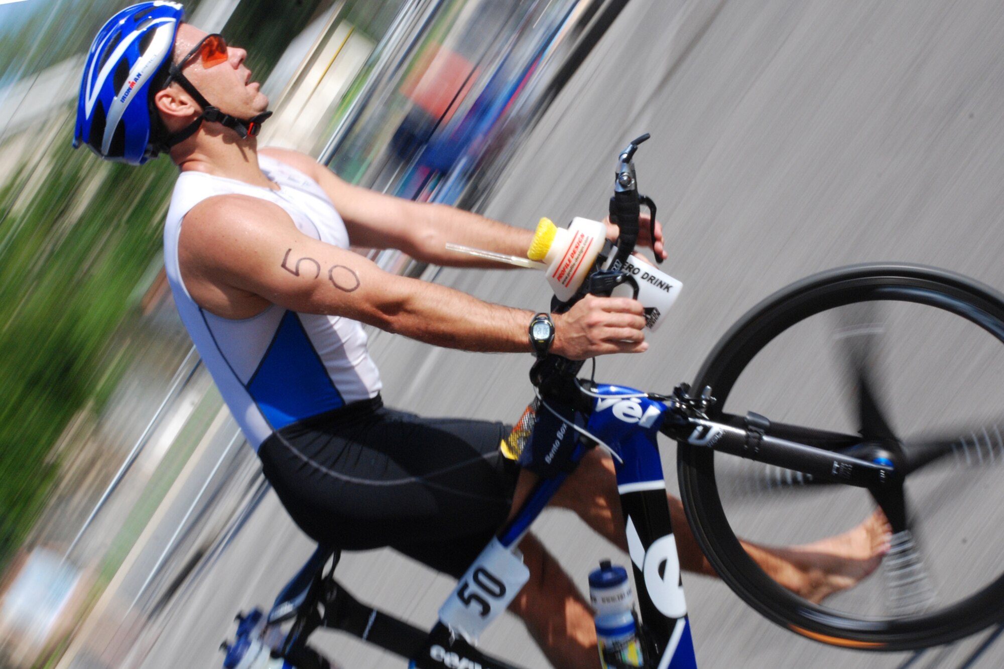 EGLIN AIR FORCE BASE, Fla. -- Eric Bartlett, of Destin, Fla., prepares to dismount his bike and strike out on the run portion of the 8th Annual My First Tri triathlon at Post'l Point June 9. The triathlon featured a 200-meter swim, 8-mile bike ride and 2.5-mile run. A total of 150 out of the 248 triathletes were participating in their first triathlon. (U.S. Air Force Staff Sgt. Mike Meares)