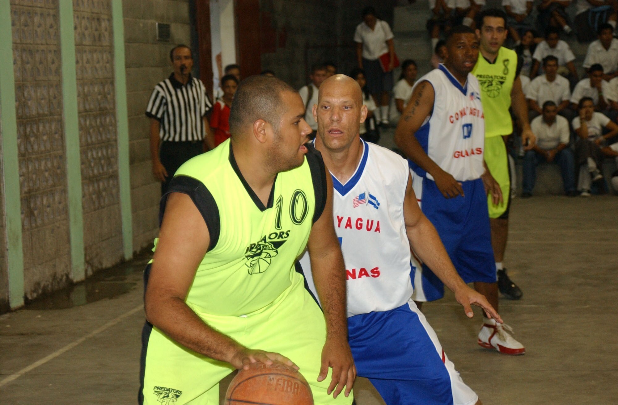 Army Staff Sgt. Pete Schaffer, a member of the Soto Cano Air Base basketball team, the Comayagua Iguanas, plays tight defense against Alejandro Cruz from the Tegucigalpa Predators. The base team traveled to Siguatepeque, Honduras to take part in a sports tournament. U.S. Air Force photo by Senior Airman Shaun Emery.