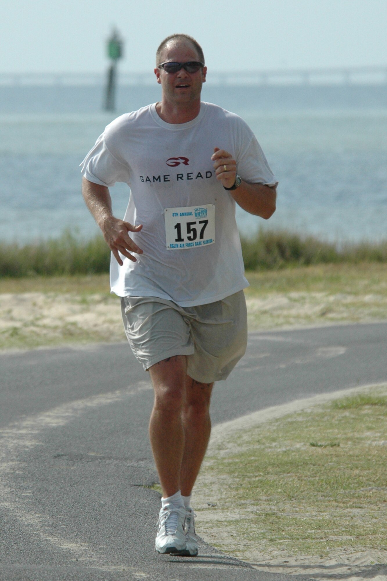 EGLIN AIR FORCE BASE, Fla. -- Danny Wuerffel, of Destin, legs out the last 100 yards at the 8th Annual My First Tri triathlon at Post'l Point June 9. Wuerffel, the 1996 Heisman Trophy Winner at the University of Florida, was competing as a first The triathlon featured a 200-meter swim, 8-mile bike ride and 2.5-mile run. A total of 150 out of the 248 triathletes were participating in their first triathlon. (U.S. Air Force Staff Sgt. Mike Meares)