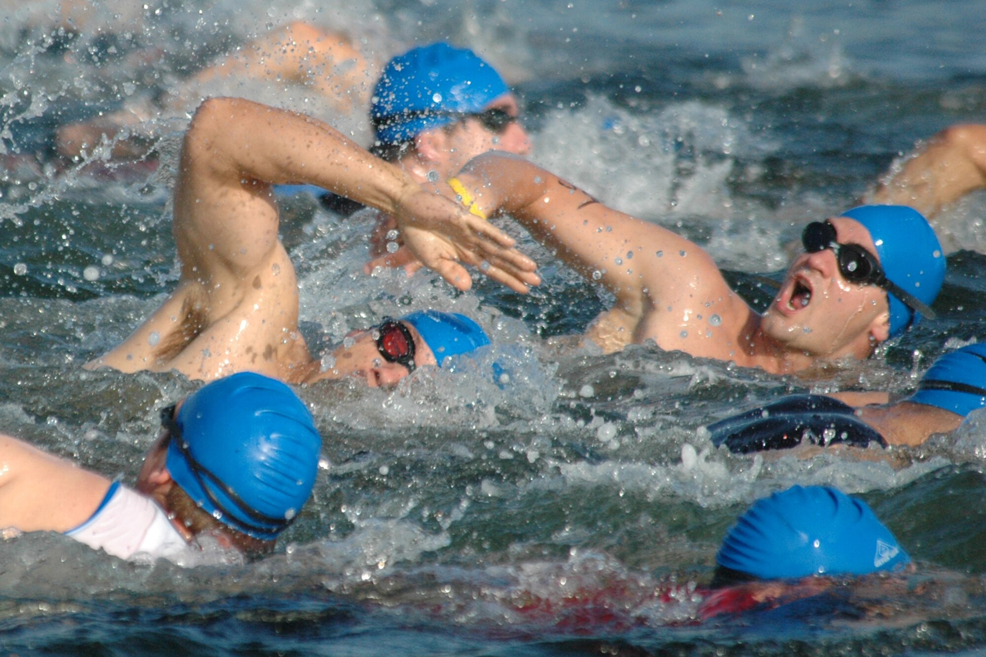 EGLIN AIR FORCE BASE, Fla. -- The first wave of alumni triathletes swim within inches of each other to gain an advantage in the 8th Annual My First Tri triathlon at Post'l Point June 9. The triathlon featured a 200-meter swim, 8-mile bike ride and 2.5-mile run. A total of 150 out of the 248 triathletes were participating in their first triathlon. (U.S. Air Force Staff Sgt. Mike Meares)