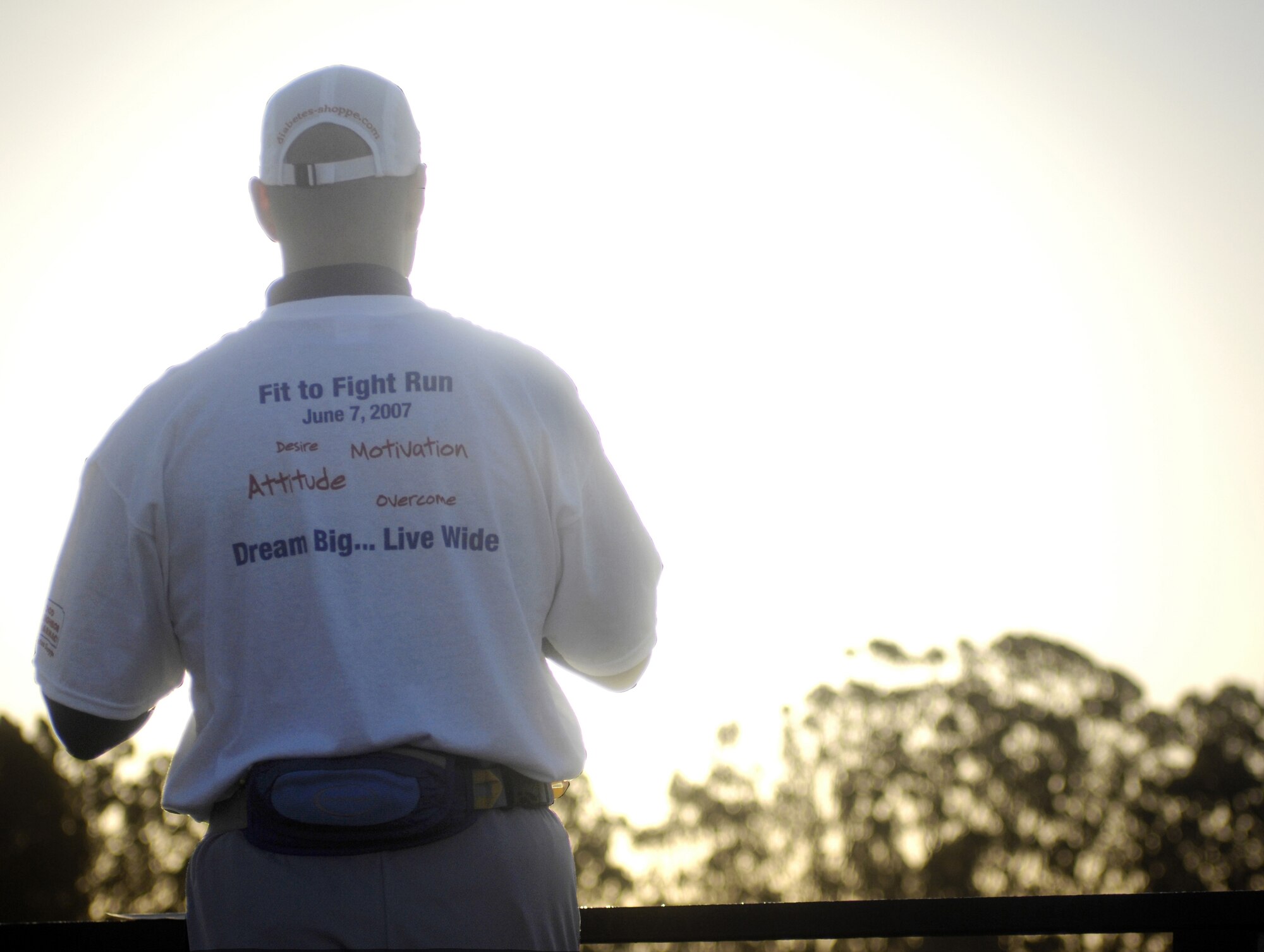 Andy Holder gives words of motivation to Airmen before the June Fit to Fight run at the base parade grounds June 7.  Mr. Holder developed type I diabetes later in life, and chose to become an Iron Man athelete and motivational speaker. (U.S. Air Force photo/Airman Jonathan Olds)