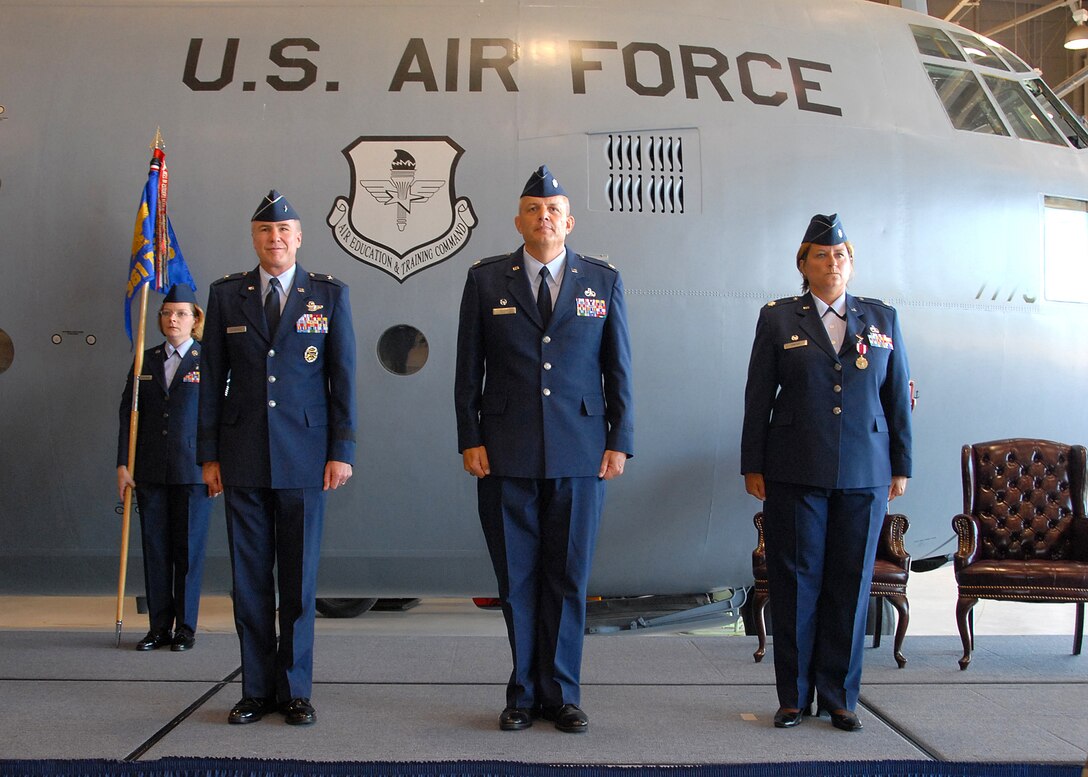 Brig. Gen. Richard Devereaux, Lt. Col. Kelly Scott and Lt. Col. Susan Santos stand at attention during the 361st Training Squadron's change-of-command ceremony June 11. Colonel Santos passed on command of the 361st TRS to Colonel Scott. (U.S. Air Force photo/Mike Litteken)