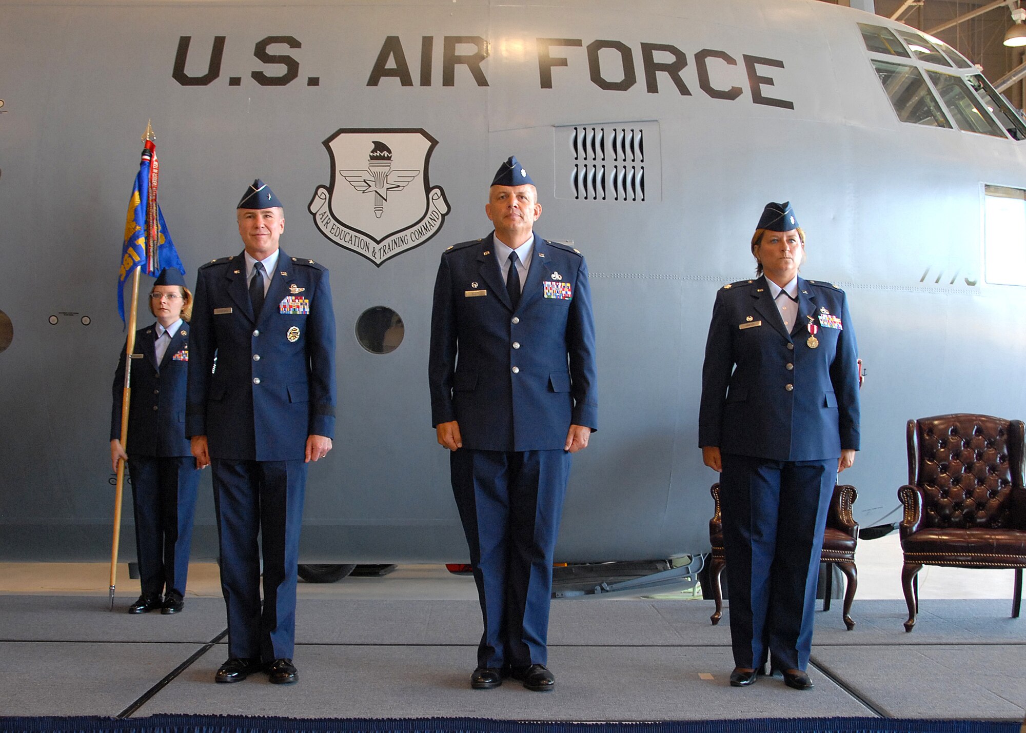 Brig. Gen. Richard Devereaux, Lt. Col. Kelly Scott and Lt. Col. Susan Santos stand at attention during the 361st Training Squadron's change-of-command ceremony June 11. Colonel Santos passed on command of the 361st TRS to Colonel Scott. (U.S. Air Force photo/Mike Litteken)
