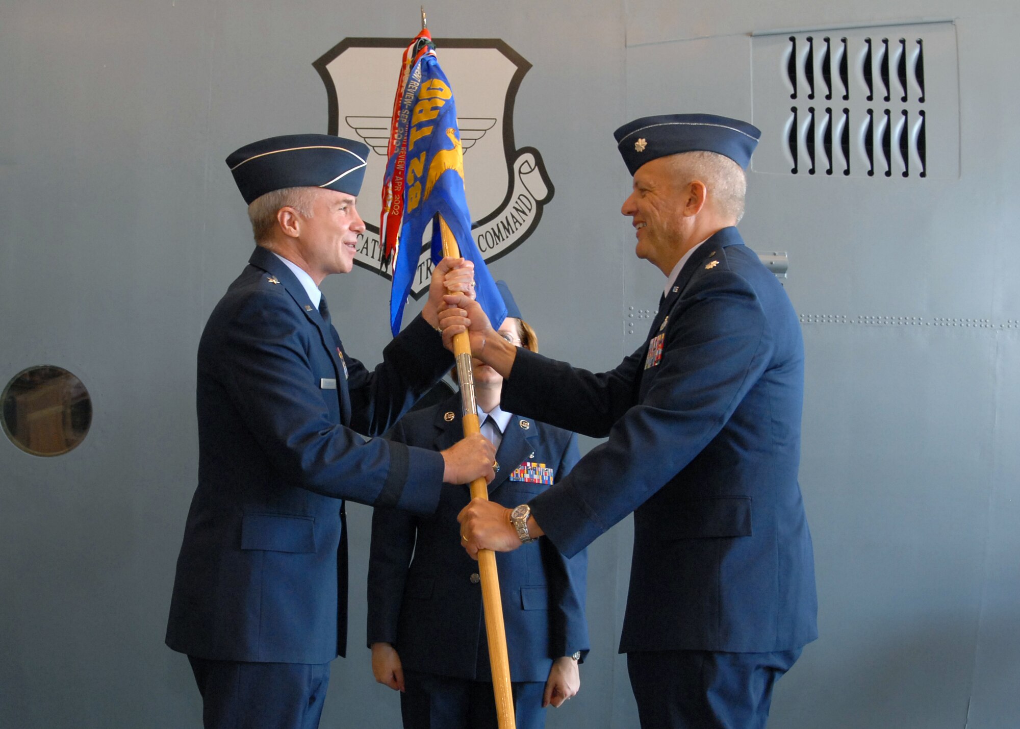 Lt. Col. Kelly Scott recieves the guidon from Brig. Gen. Richard Devereaux during the 361st Training Squadron change-of-command ceremony June 11. Colonel Scott was passed command of the 361st TRS from Lt. Col. Susan Santos . (U.S. Air Force photo/Mike Litteken)