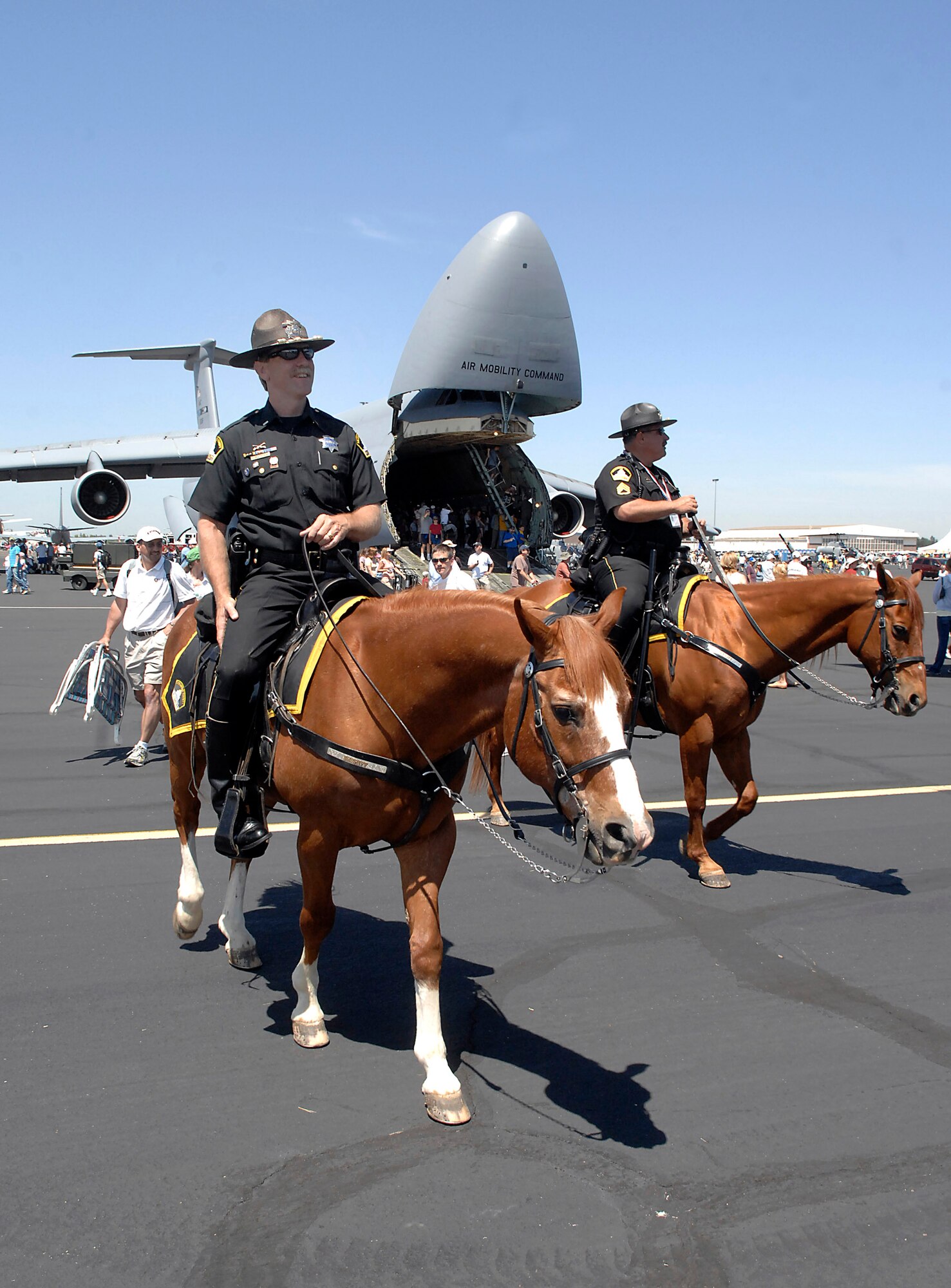 Lt. Milo Fitch ( left) and Sgt. Mark Maubach from the Sacramento County Sheriff's Department provide security at the California Capital Air Show in Sacramento, Calif., June 9.  The air show was the last event of Air Force Week California. The purpose of Air Force Week is to inform and educate the American public about the importance and roles of the Air Force in America's national defense. More than 50,000 people attended the air show featuring the Air Force Thunderbirds and numerous Air Force aircraft. (U.S. Air Force photo/Tech. Sgt. Larry A. Simmons)