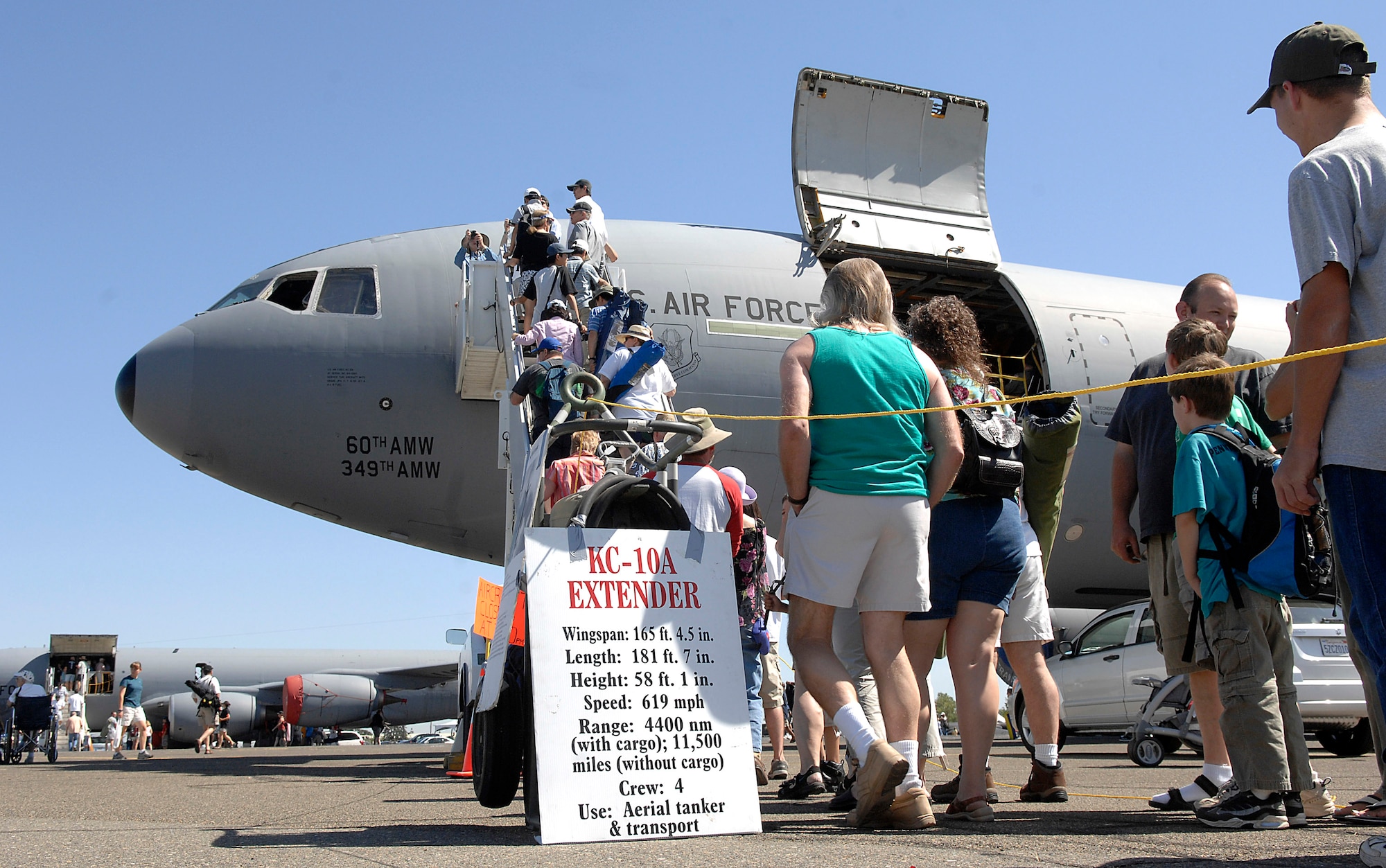 People line up to see the inside of a KC-10 Extender at the California Capital Air Show in Sacramento, Calif., June 9. The air show was the last event of Air Force Week California. The purpose of Air Force Week is to inform and educate the American public about the importance and roles of the Air Force in America's national defense. More than 50,000 people attended the air show featuring the Air Force Thunderbirds and numerous Air Force aircraft. (U.S. Air Force photo/Tech. Sgt. Larry A. Simmons)