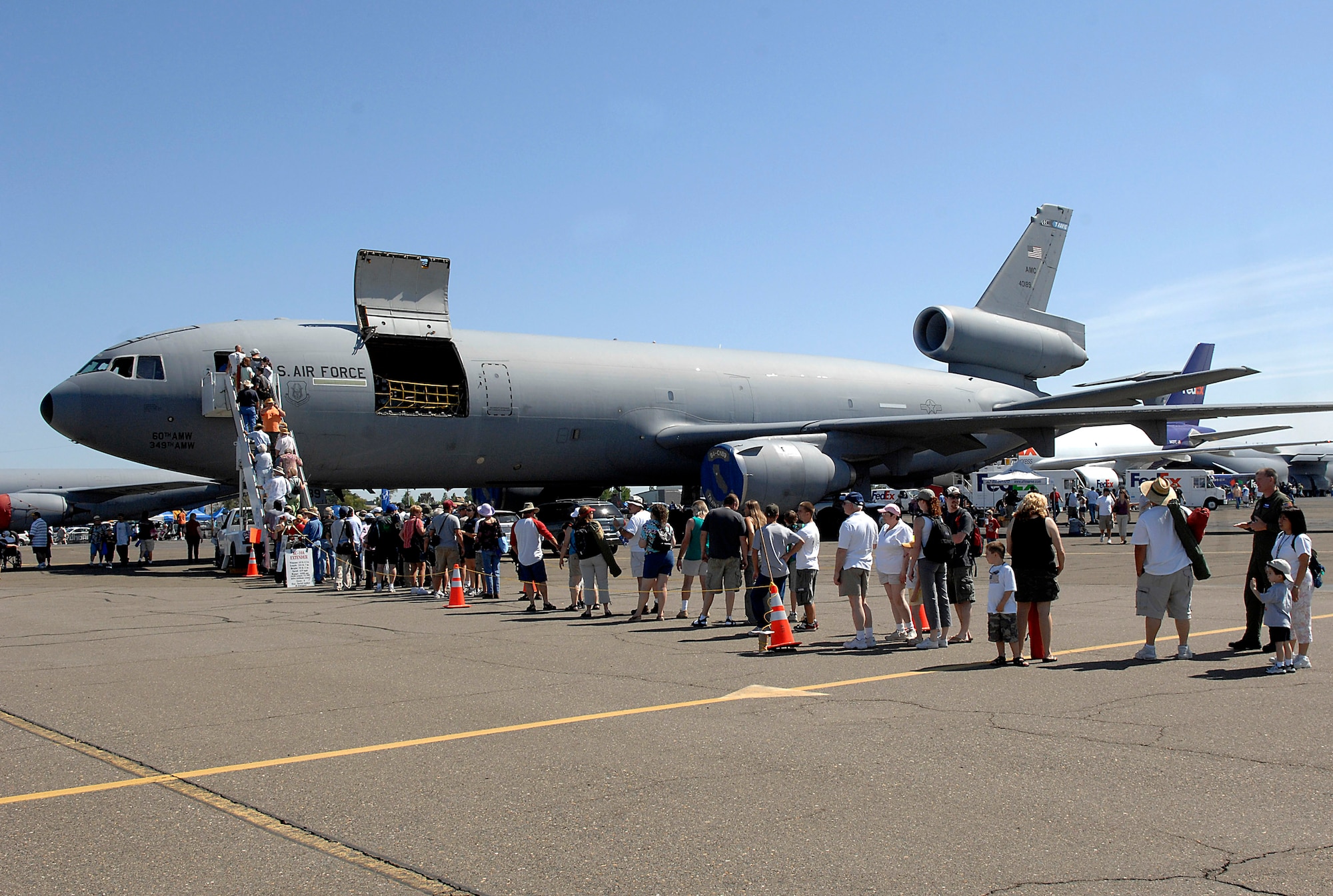 People line up to see the inside of a KC-10 Extender at the California Capital Air Show in Sacramento, Calif., June 9. The air show was the last event of Air Force Week California. The purpose of Air Force Week is to inform and educate the American public about the importance and roles of the Air Force in America's national defense. More than 50,000 people attended the air show featuring the Air Force Thunderbirds and numerous Air Force aircraft. (U.S. Air Force photo/Tech. Sgt. Larry A. Simmons)