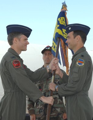 DAVIS-MONTHAN AIR FORCE BASE, Ariz. -- Lt. Col. David A. Delmonaco (right) receives the 43rd Electronic Combat Squadron guidon from 55th Electronic Combat Group Commander Col. Mark S. Haskins during a change-of-command ceremony here June 8. (U.S. Air Force Photo/Airman 1st Class Noah Johnson)