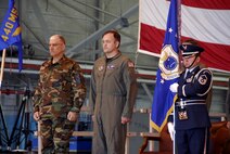 Col. Merle D. Hart, 440th Airlift Wing commander, stands with Chief Master Sgt. Carmon Francher, wing command chief master sergeant, during the unit's relocation ceremony June 9, 2007, at Gen. Mitchell International Airport Air Reserve Station in Milwaukee. The motto on the wing flag is Nunquam Non Paratus ? ?Never unprepared." (U.S. Air Force photo/Joe Oliva)