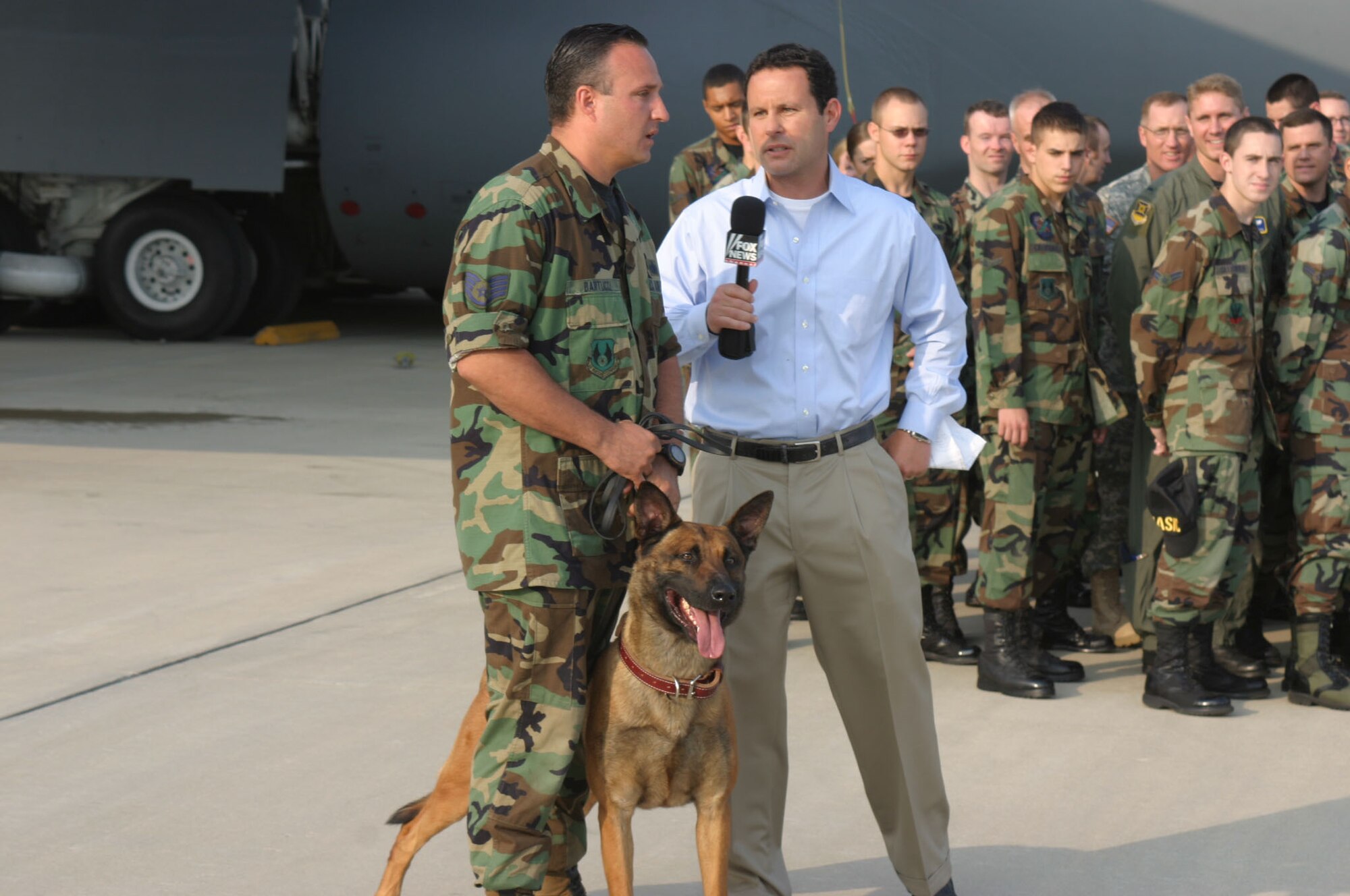 During one live segment from Wright-Patterson Air Force Base, Ohio, "FOX and Friends" co-anchor Brian Kilmeade talks with Staff Sgt. Christopher Bartucci from the 88th Security Forces Squadron military working dog section. A demonstration in which Sergeant Bartucci and his dog, Oowen, detained a "fleeing suspect" was broadcast live. (U.S. Air Force photo/Master Sgt. Doug Moore) 

