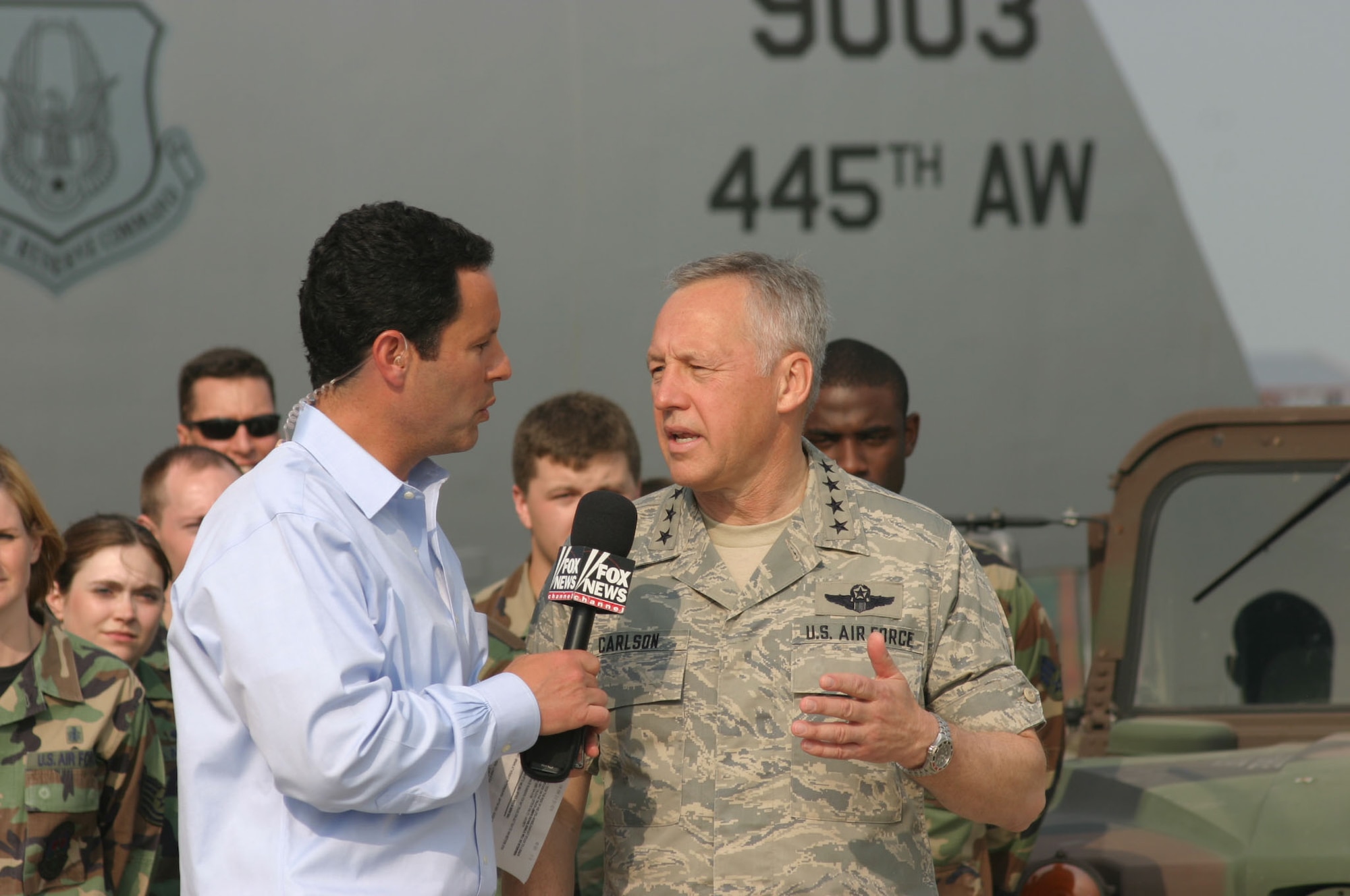 Gen. Bruce Carlson, commander of Air Force Materiel Command, explains the need to recapitalize the Air Force's aging aircraft fleet to "FOX and Friends" co-anchor Brian Kilmeade during a live broadcast from Wright-Patterson Air Force Base, Ohio, June 8. (U.S. Air Force photo/Master Sgt. Doug Moore) 
