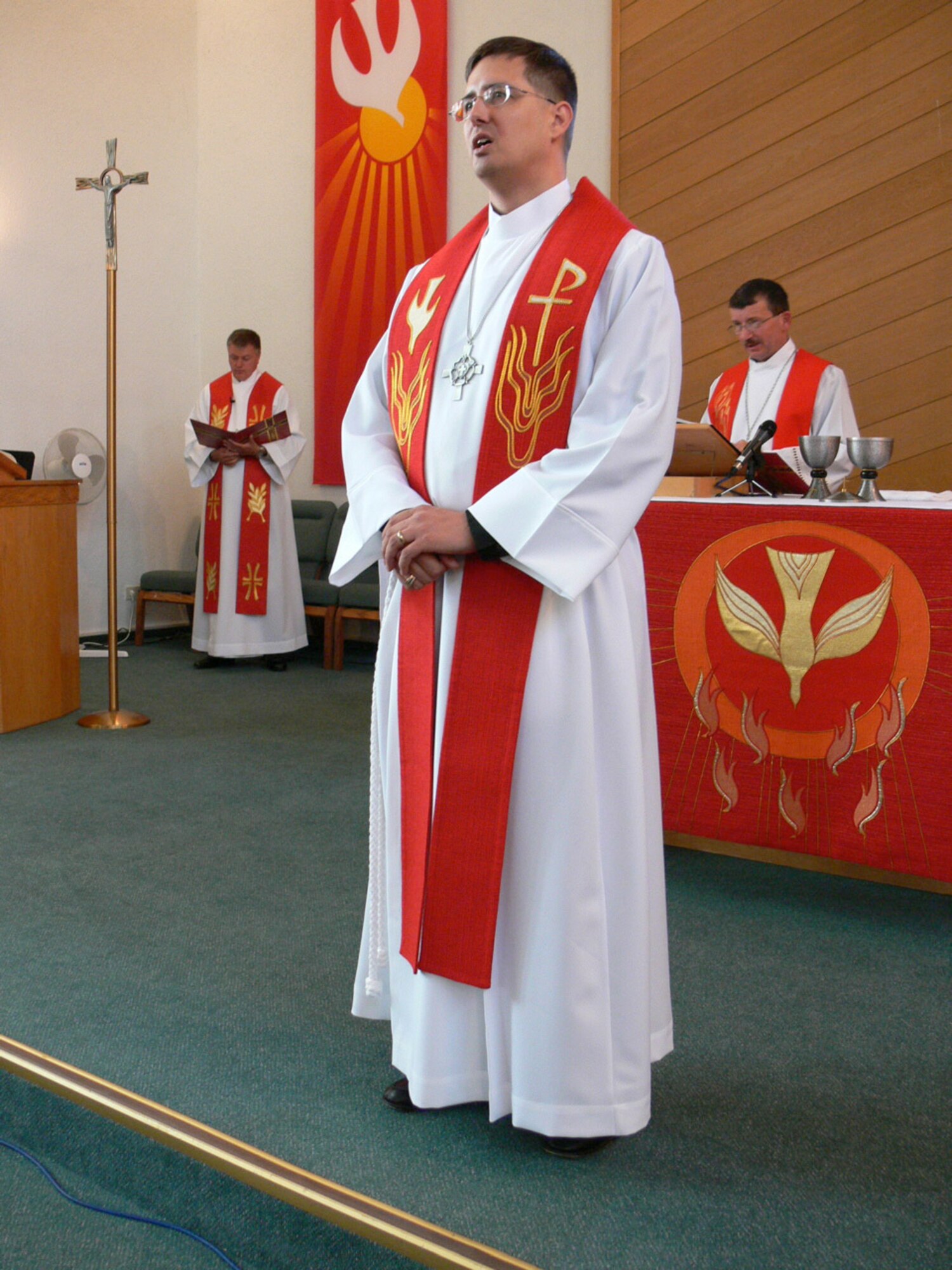 Pastor (Capt.) Scott Jensen says a prayer June 3 at Ramstein’s South Chapel after he is ordained as a Luthern pastor. Photo by Monica Mendoza