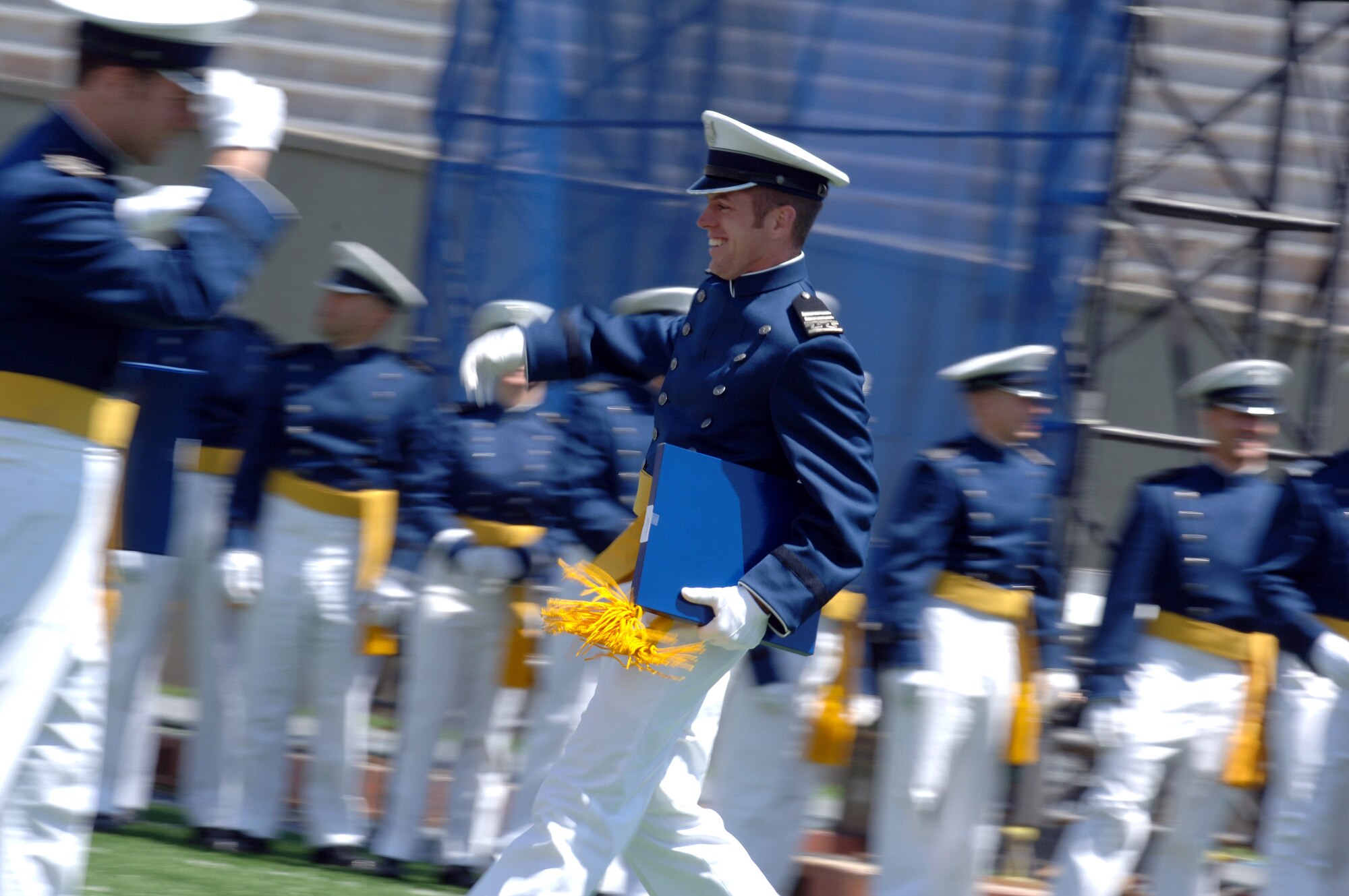 One of the Air Force’s newest second lieutenants returns a salute to one of his classmates following receipt of his degree from the U.S. Air Force Academy May 30 in Colorado. The Leaders Encouraging Airmen Program offers 135 slots to qualified, commander-nominated Airmen. Photo by Joel Strayer
