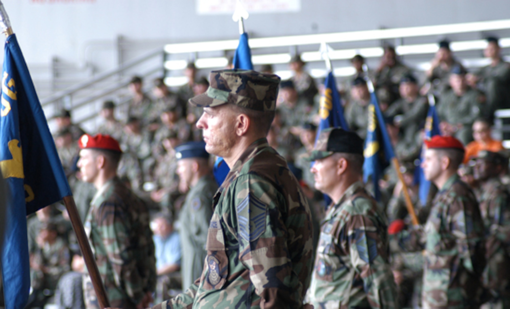 First sergeants from each squadron of the 353rd Special Operations Group proudly display their unit guidons during the change of command ceremony at Kadena Air Base, Japan, June 8.  Senior Master Sgt. Jerry Wilkerson, 353rd Operations Support Squadron first sergeant is shown above.
(U.S. Air Force/Master Sgt. Marilyn Holliday)