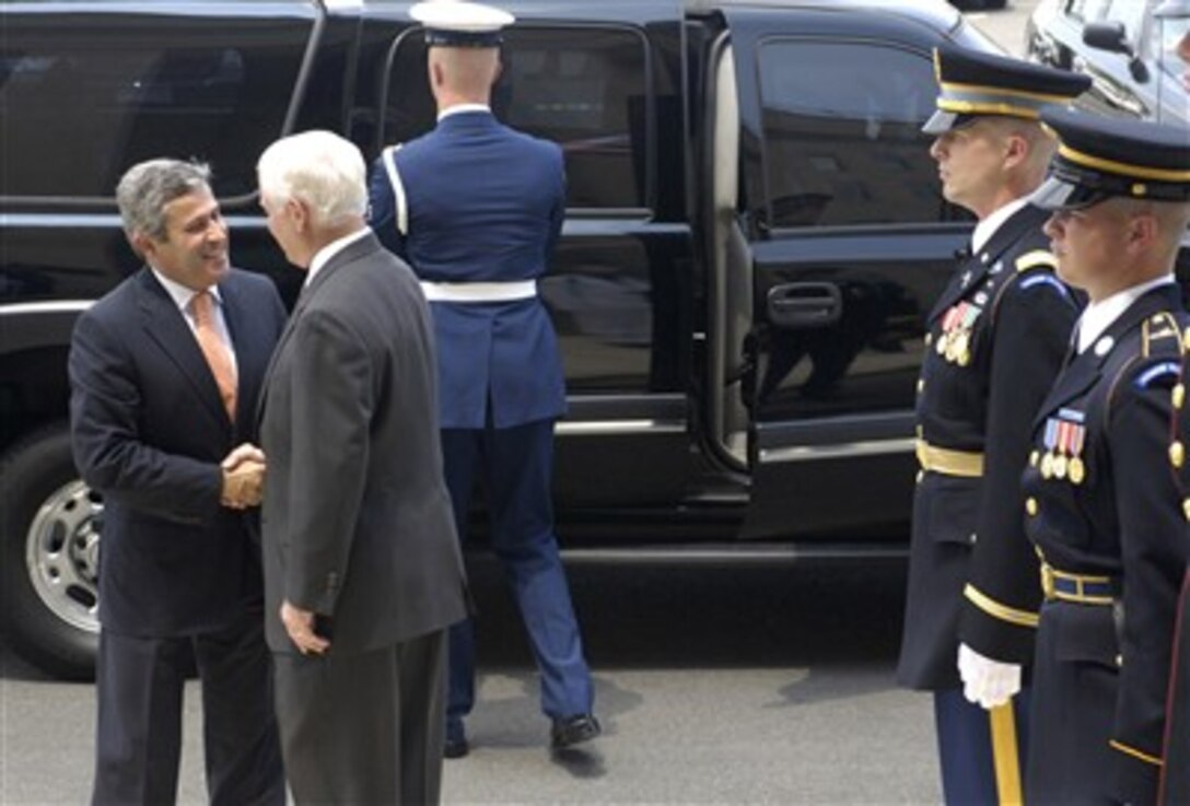 Defense Secretary Robert M. Gates (right) greets Portuguese Defense Minister Nuno Severiano Teixeira as he arrives at the Pentagon, June 8, 2007.  The defense leaders discussed bilateral security issues.  