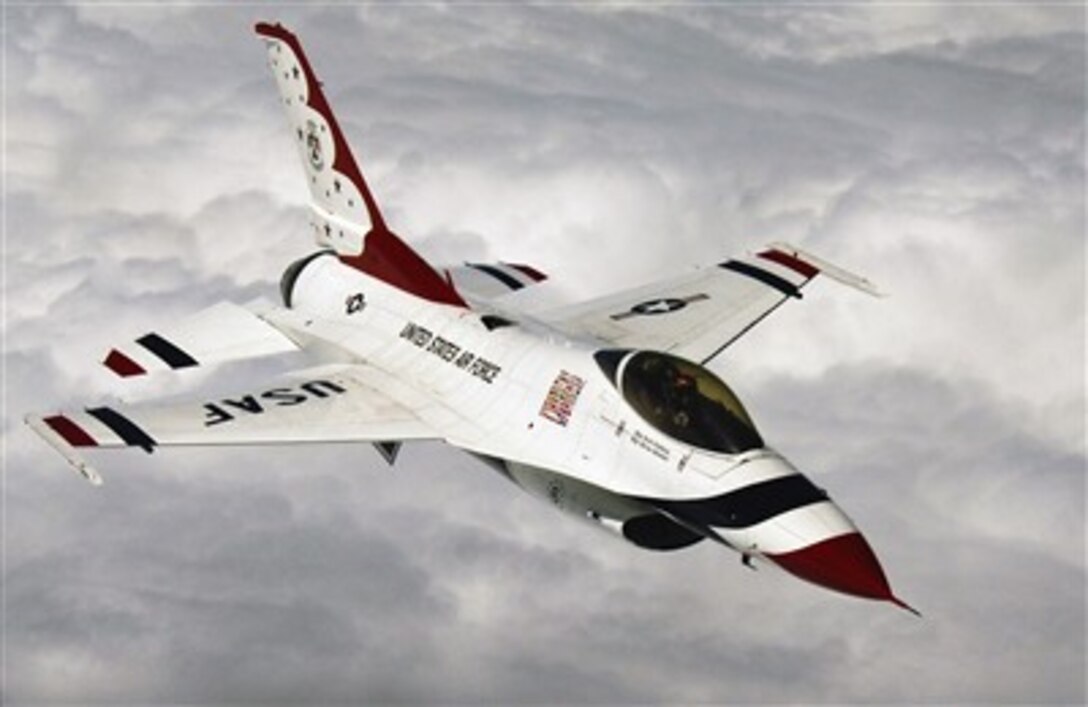 A U.S. Air Force F-16 Fighting Falcon aircraft from the Thunderbird aerial demonstration team flies over McConnell Air Force Base, Kan., after refueling from a KC-135 Stratotanker on Sept. 7, 2006.  