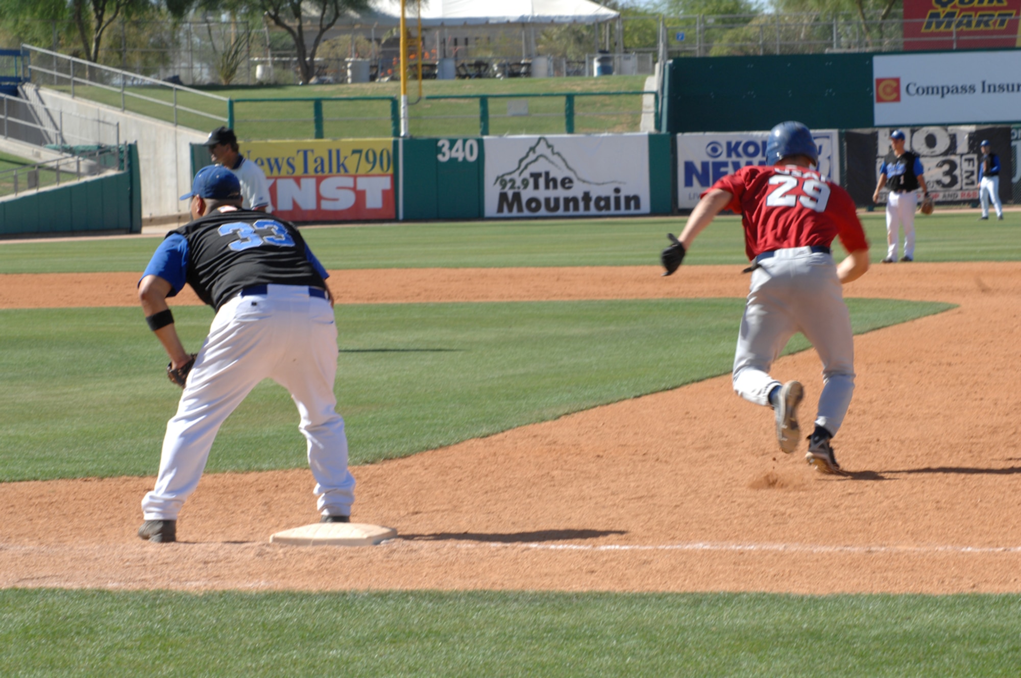 Davis-Monthan Mustangs left fielder Ryan Clements runs to second base during the June 8 rivalry game between Luke and D-M at Tucson Electric Park. Clements was 3-for-4 in the game with a double and two singles. (U.S. Air Force photo/Airman 1st Class Alesia D. Goosic)