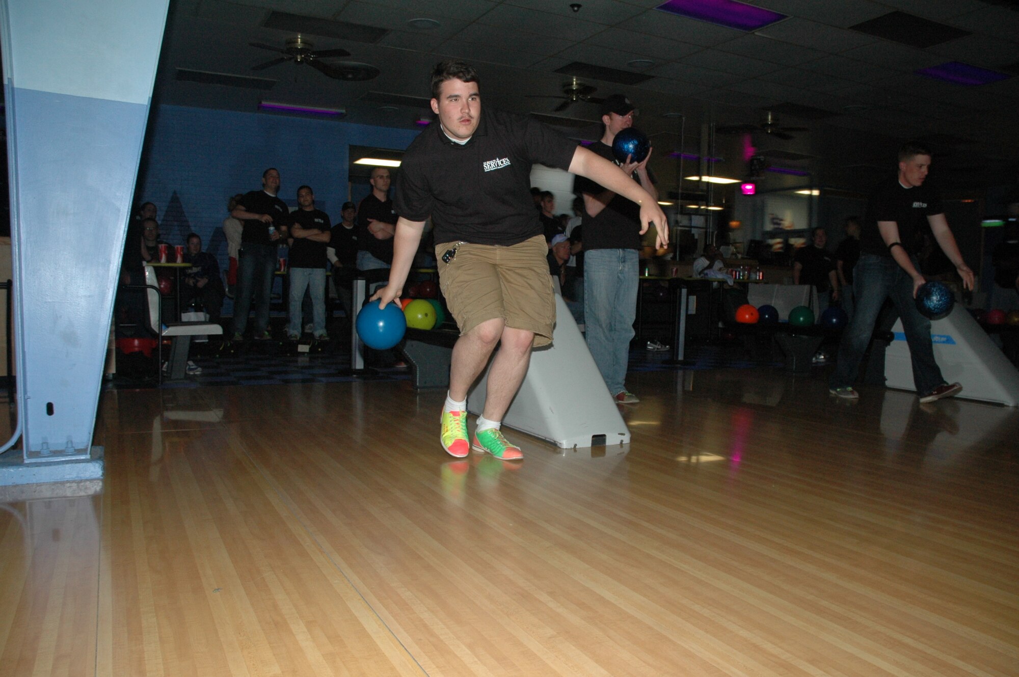 Airman 1st Class Steven Mason, 90th Missile Maintenance Squadron, bowls as a participant in the first event of the Warren Xtreme Team Challenge at the base bowling center June 1. The challenge is a four-part competition with teams of eight that wraps up June 23 with an awards ceremony. The winning team will be announced at the ceremony (Photo by Staff Sgt. Gerald Teano).