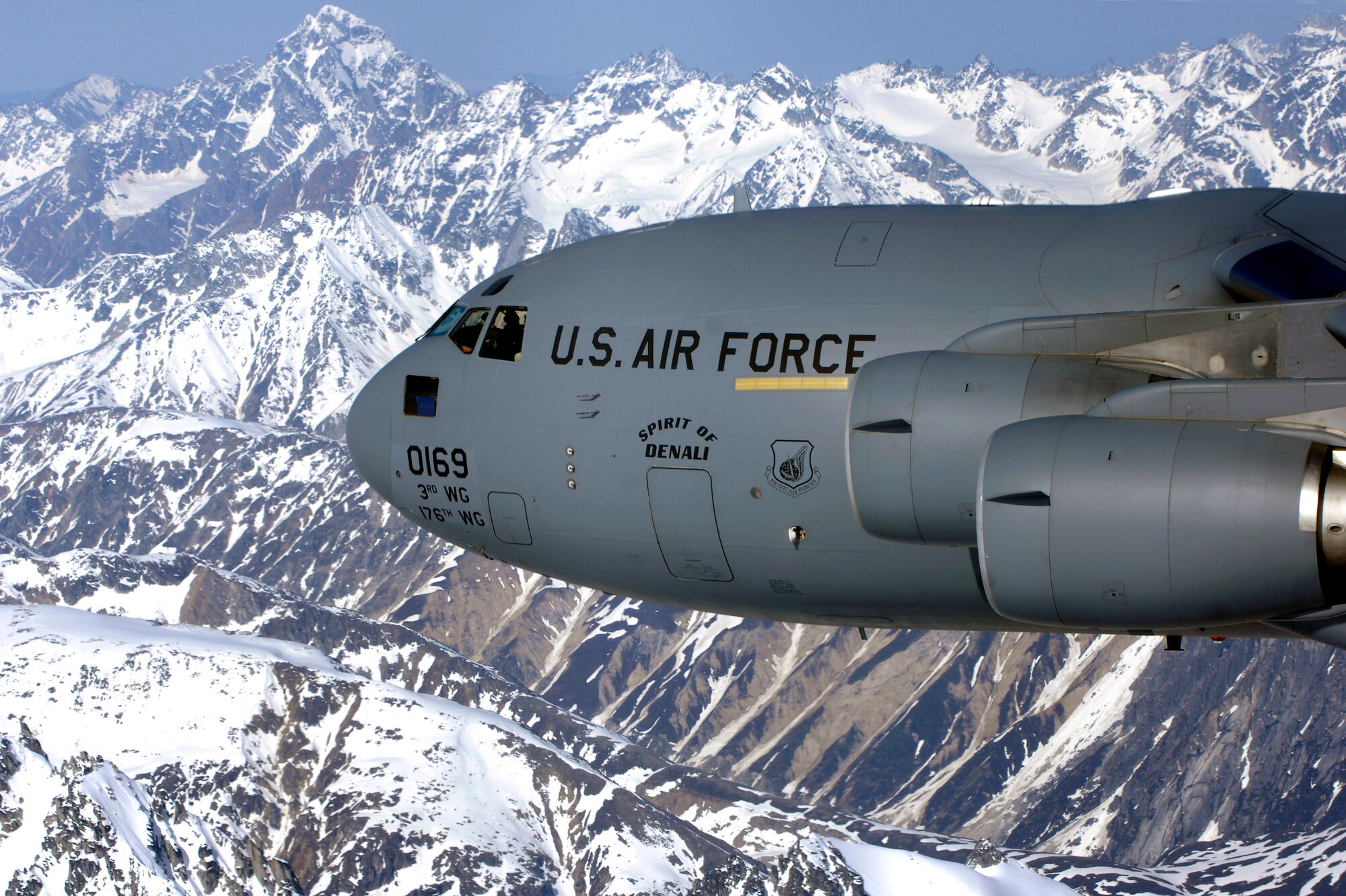 The "Spirit of Denali" flies over the Alaska Range June 11 en route to Elmendorf Air Force Base, Alaska.  This C-17 Globemaster IIIs was the first of eight to be stationed at Elmendorf.  The airlifters will be flown by both active duty aircrews in the 517th Airlift Squadron and by Air National Guard aircrews in the 249th Airlift Squadron. (U.S. Air Force photo/Tech. Sgt. Keith Brown)