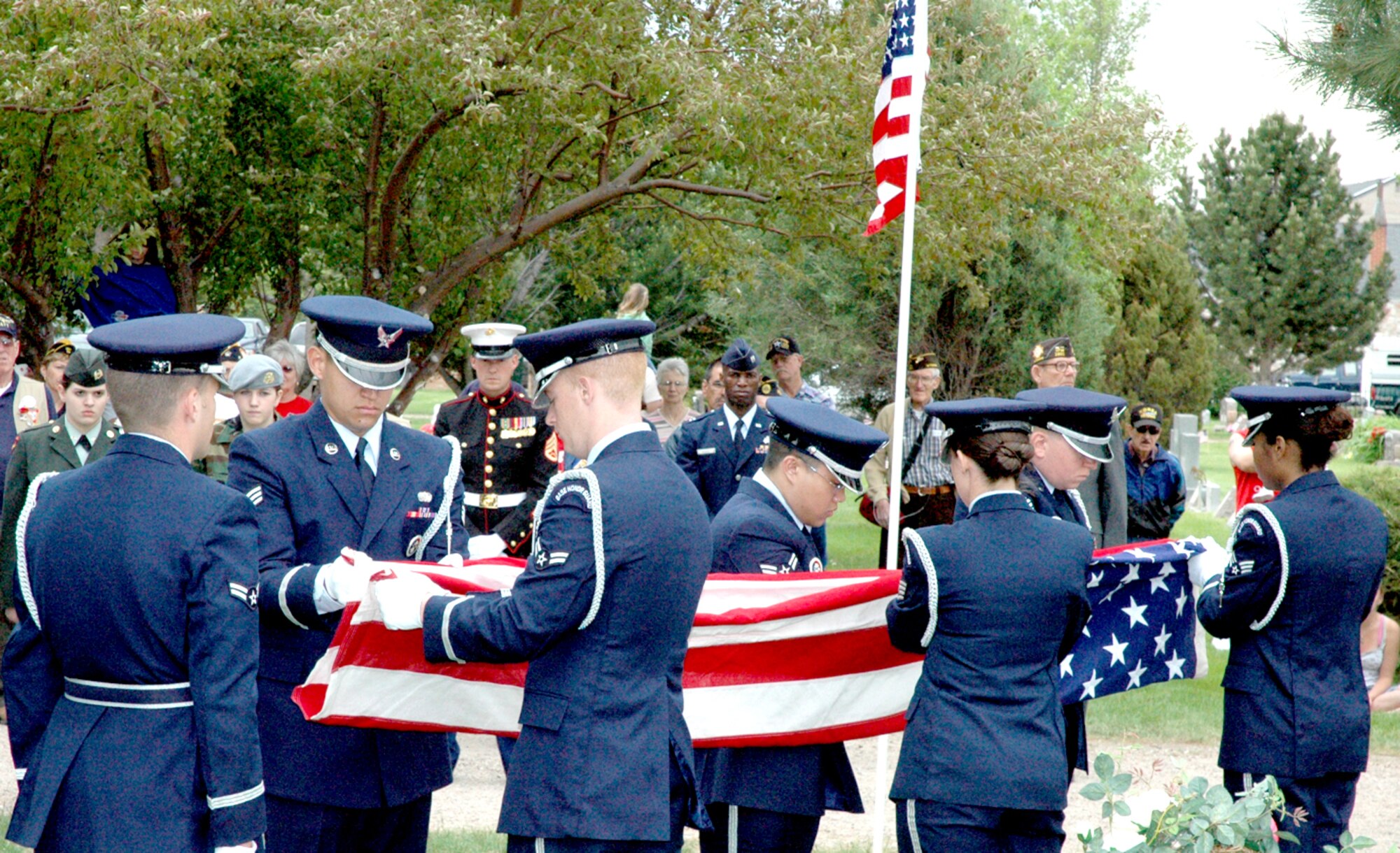 Members of the Warren Honor Guard fold a flag concluding a Memorial Day service at the Beth El Cemetery (Photo by Staff Sgt. Chad Thompson).