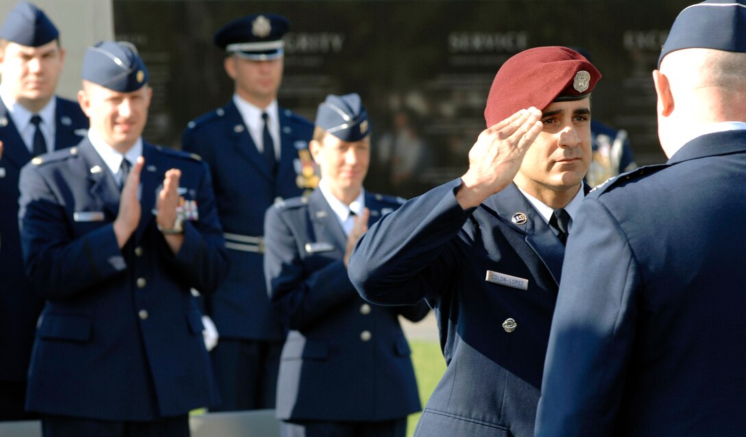 Senior Master Sgt. Ramon Colon-Lopez salutes Air Force Chief of Staff Gen. T. Michael Moseley after being presented the Air Force Combat Action Medal. The medal was presented to six Airmen in a ceremony held at the Air Force Memorial June 12 in Arlington, Va., June 12. (U.S. Air Force photo/Staff Sgt. Brian Ferguson) 