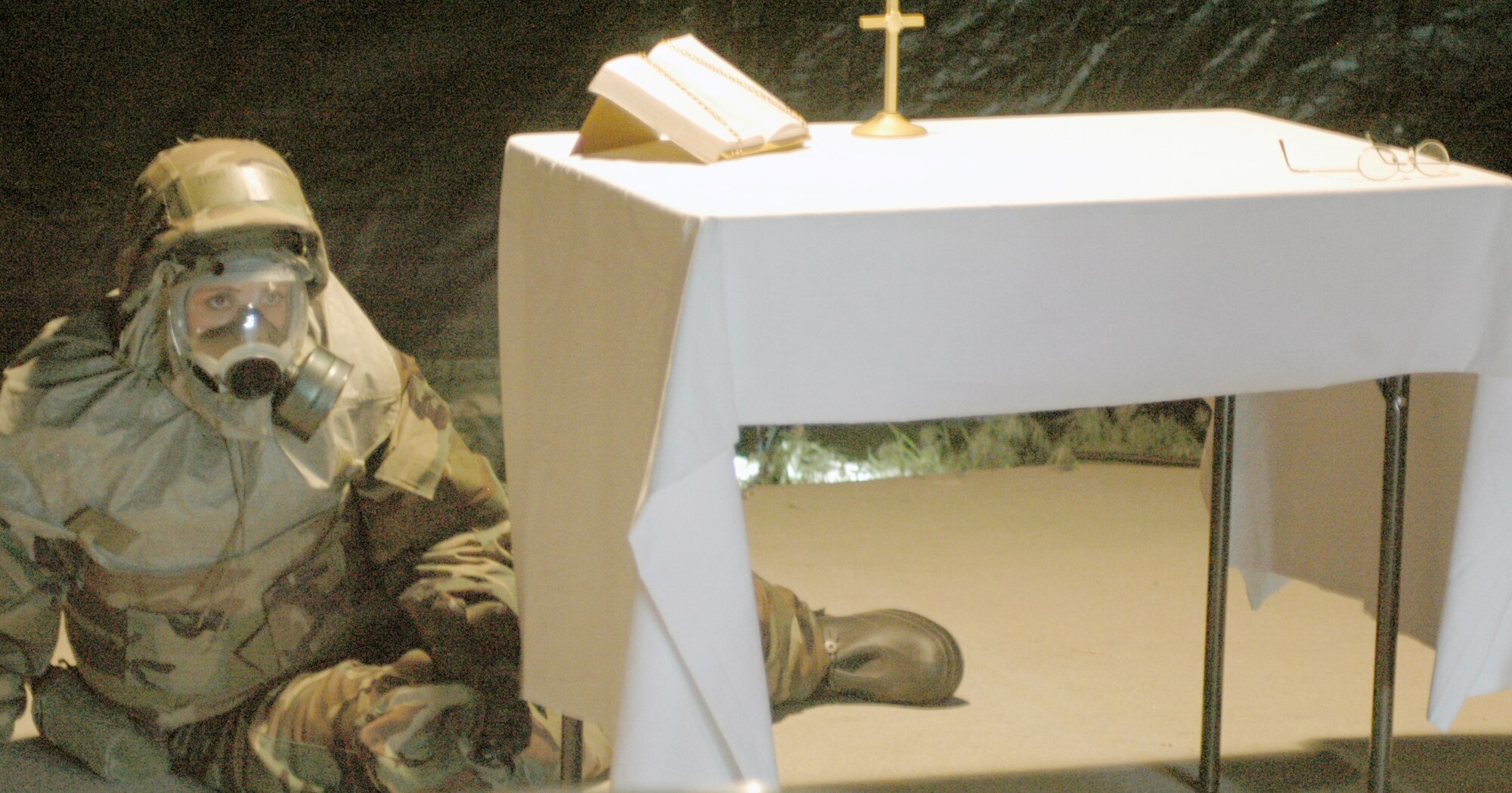 Airman 1st Class Cansu Teano, 90th Contracting Squadron, sits and waits patiently after changing into MOP 4 gear after a simulated missile attack during the deployment exercise.