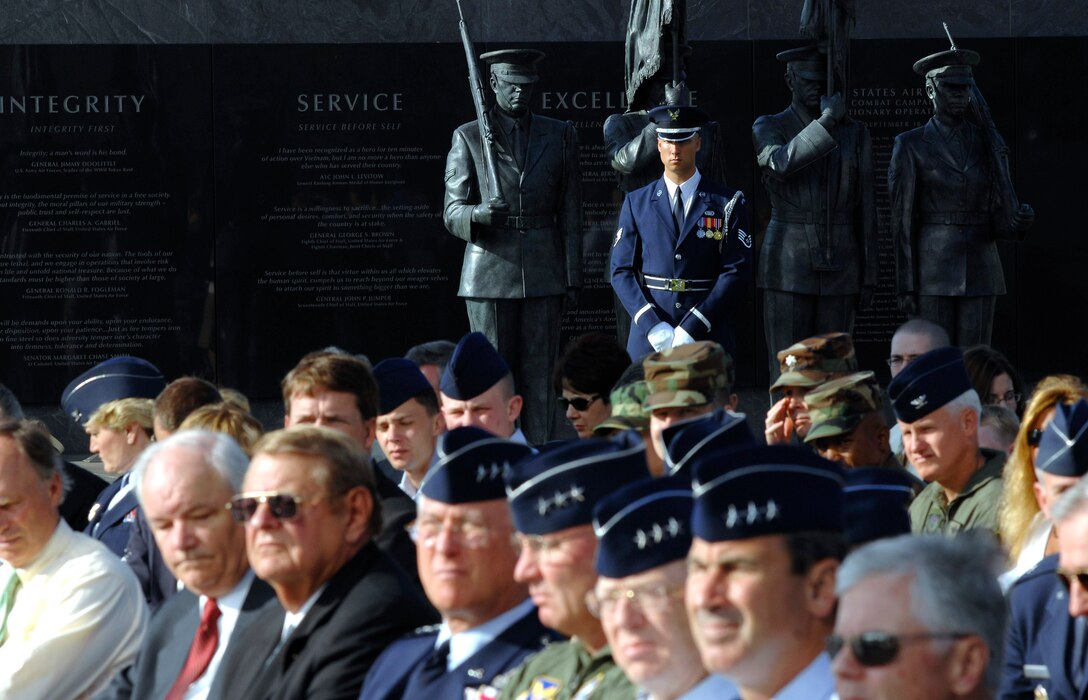 Staff Sgt. Michael Rowson stands in front of an honor guard statue during a ceremony June 12 where six Airmen were each presented the new Air Force Combat Action Medal. They were the first to receive the medal in a ceremony held at the Air Force Memorial in Arlington, Va. (U.S. Air Force photo/Staff Sgt. Brian Ferguson)