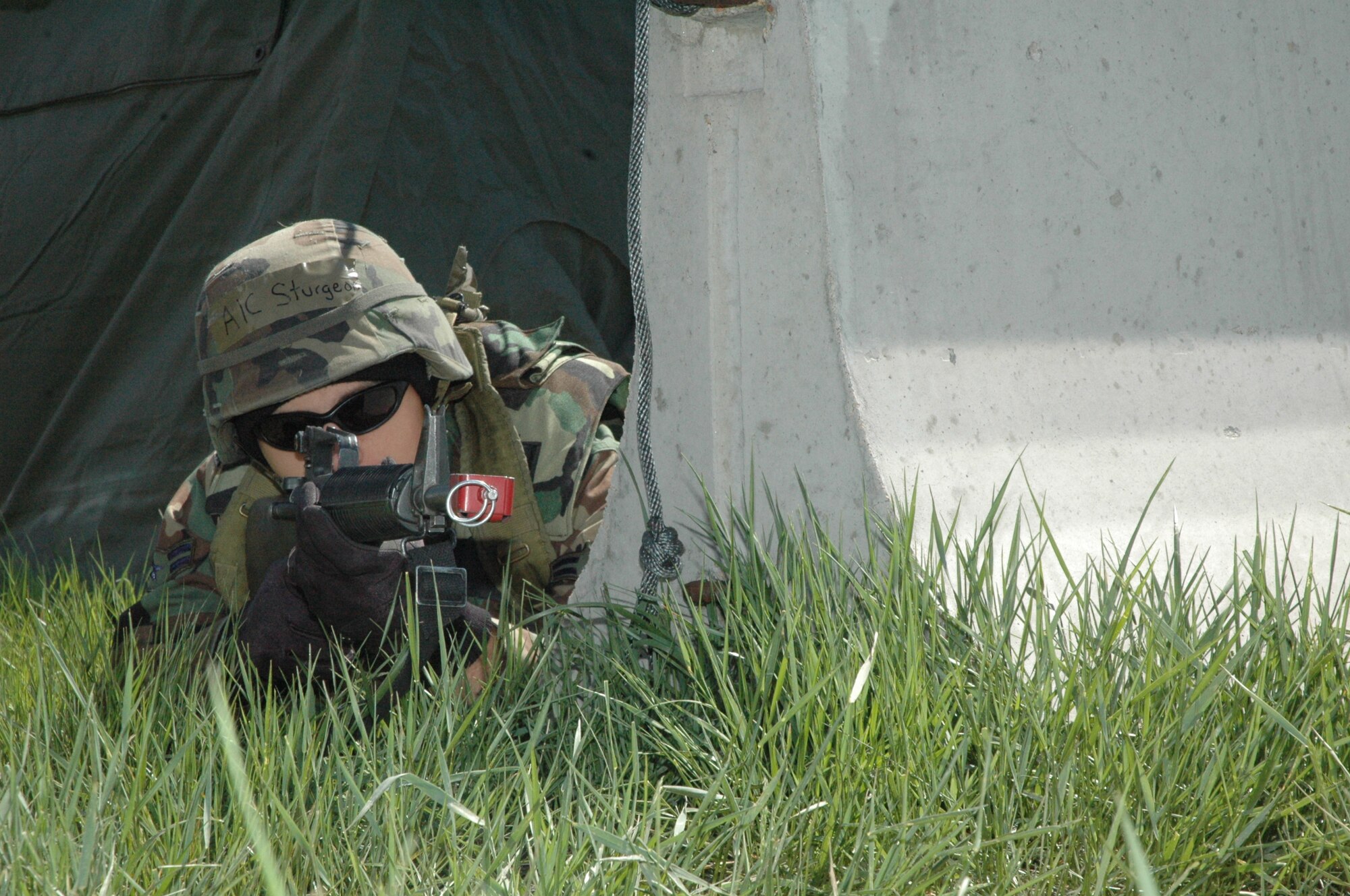 Airman 1st Class Drew Sturgeon, 90th Civil Engineer Squadron, assumes the prone position for a mock mortar attack during the Field Warrior Exercise May 24. The exercise was a four-day, two-phase deployment exercise testing Warren Airmen’s knowledge of their respective mission capabilities (Photos by Airman 1st Class Daryl Knee). 