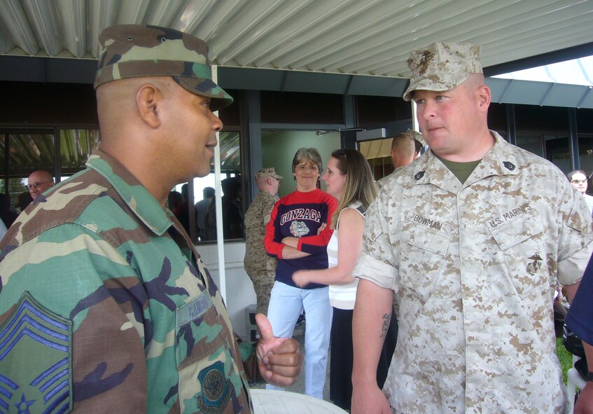 FAIRCHILD AIR FORCE BASE, Wash. -- Chief Master Sergeant Tony Cameron, 92nd Mission Support Group superintendent, talks to a Marine June 9 during an event for more than 150 local Marines, who will be deploying soon, and their families. Members of Team Fairchild and Operation Spokane Heroes were there to send them off. (U.S. Air Force photo/Capt. Jason McCree)
