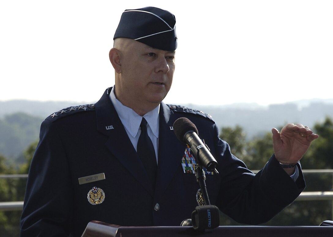 Air Force Chief of Staff Gen. T. Michael Moseley presides over a ceremony at the Air Force Memorial in Arlington, Va., June 12 to award six Airmen the Combat Action Medal. The AFCAM is the first medal of its kind for the Air Force. The medal is awarded to Airmen who have been directly in harm's way, engaging enemy forces. (U.S. Air Force photo/Donna Parry)